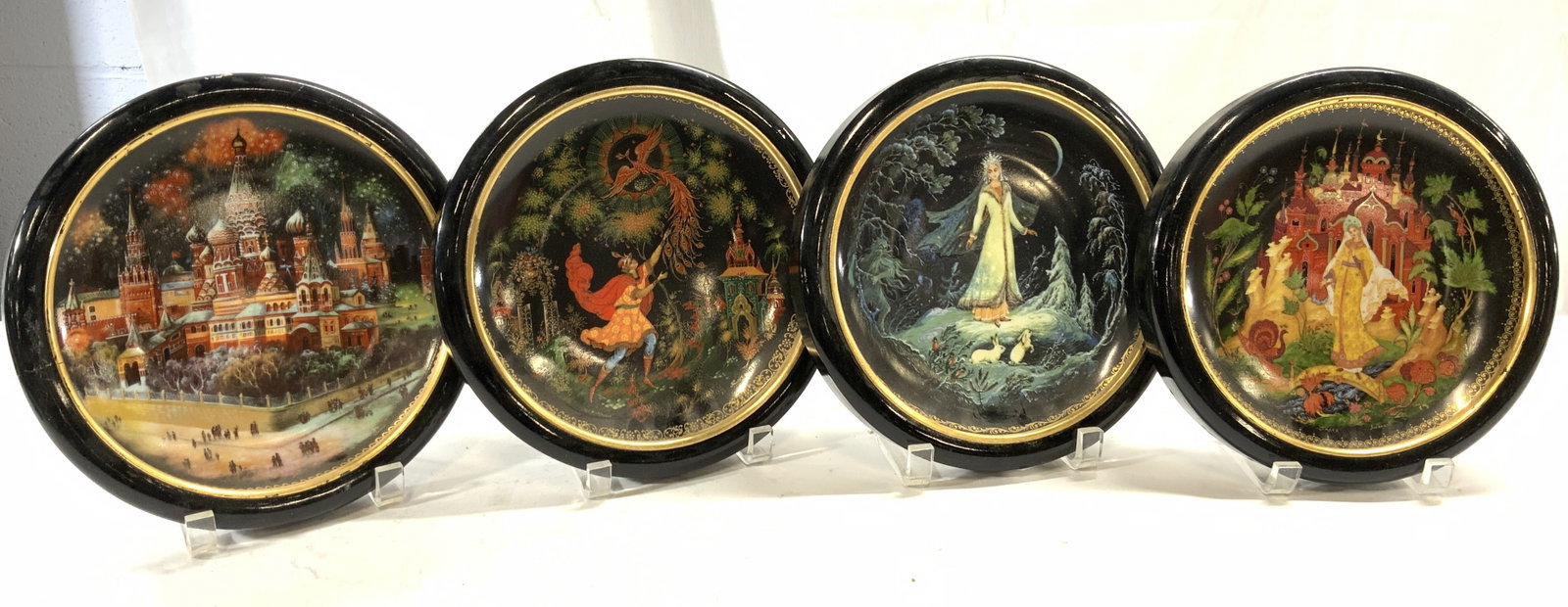 BRADEX Lot 4 Assorted Porcelain Plates W Frames: Lot includes 4 porcelain plates. Backsides of each are marked BRADEX. includes 1 with angel, 1 with image of Russian architecture, 1 with Russian architecture & female figure & 1 figure releasing a ph