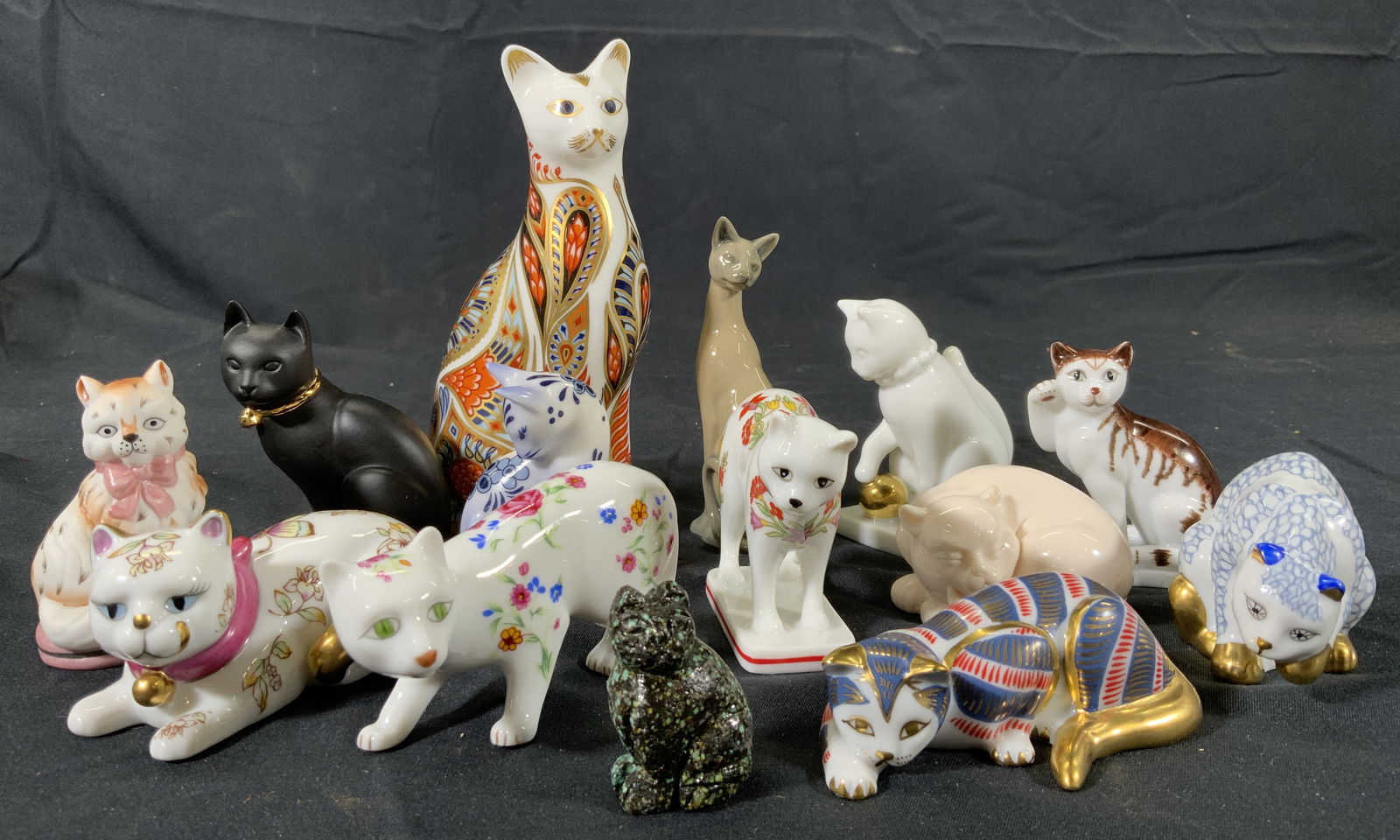 Lot 14 The Franklin Mint & More Cat Figurals: 14 Porcelain cat figurals. 12 are from the Franklin Mint. Largest figural is Bone China from the English Royal Crown Derby. Gilt accents to figurine. Measures approx. 5.75 H x 3 W x 2 D in. Smallest c