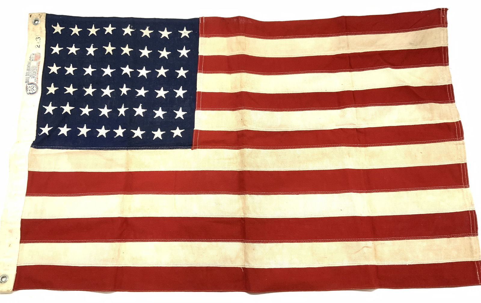 Bull Dog Bunting Linen American Flag: 2 x 3 ft Bull Dog Bunting 2 ply linen American flag with grommets. Made in the USA. Has discoloration consistent with use and exposure. Americana, American flag, bull dog bunting American flag, Made i