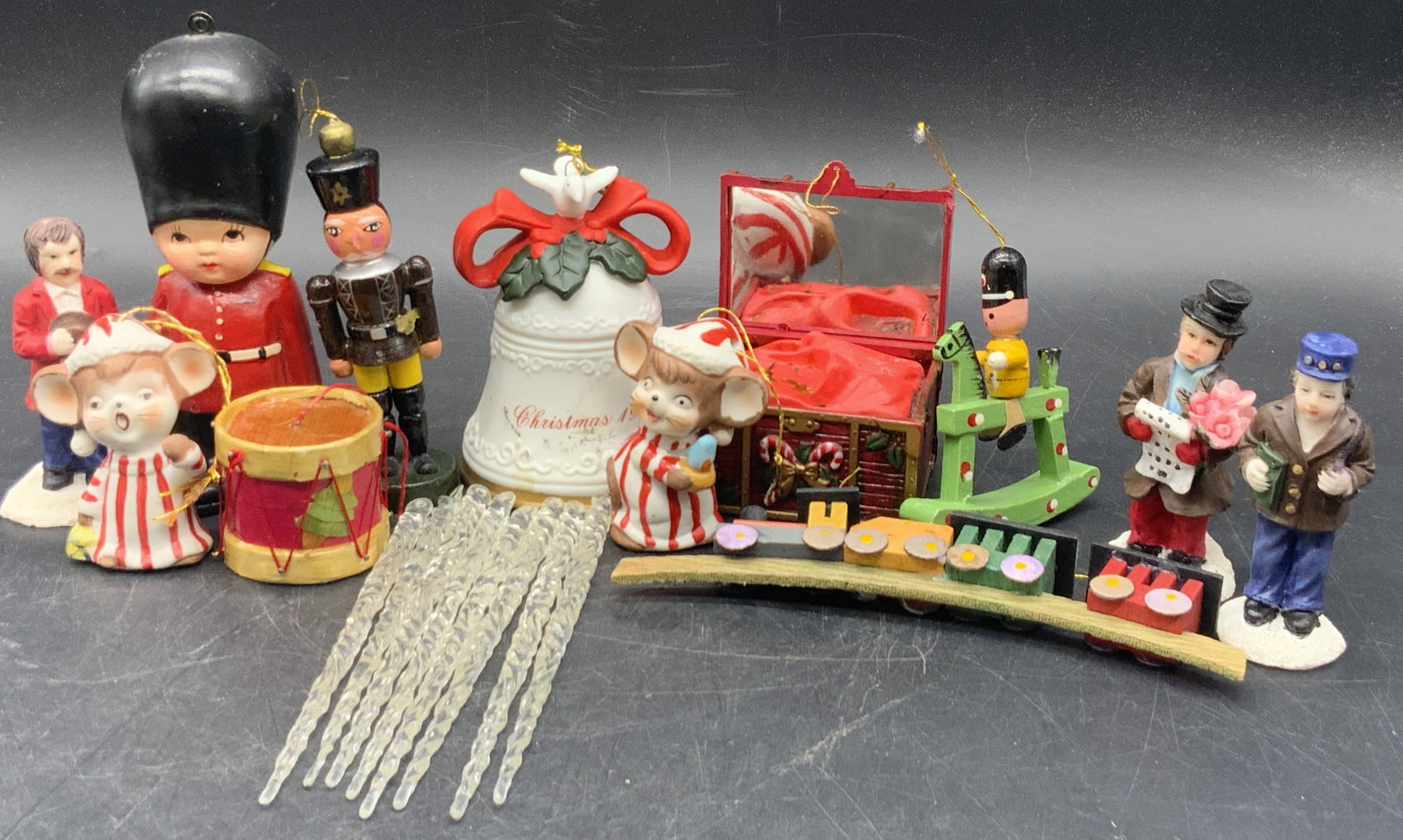 Lot 20 Vintage Christmas Holiday Ornaments & Decor: Twenty vintage pieces of Christmas holiday decor and ornaments. Soldiers, mice, carolers, and more. Lot includes pieces crafted from ceramics, wood, and composite materials. Some undersides have stick