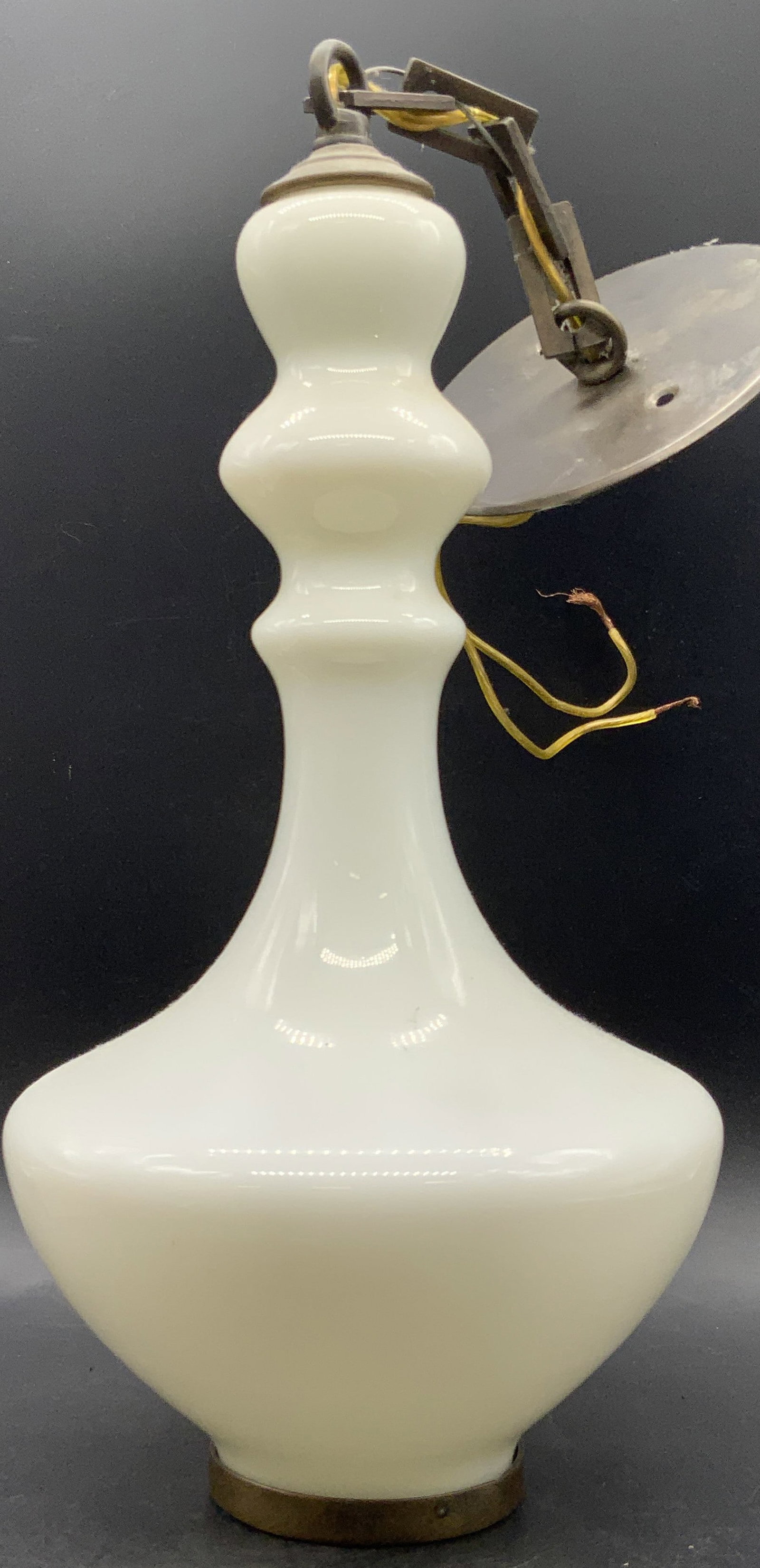White Glass Pendant Light: A white glass pendant light with metal hardware. Measures approx. 20L x 8W in. Measurement includes hardware. Not tested for function. Some wear consistent with age, use, and exposure. Lighting, light
