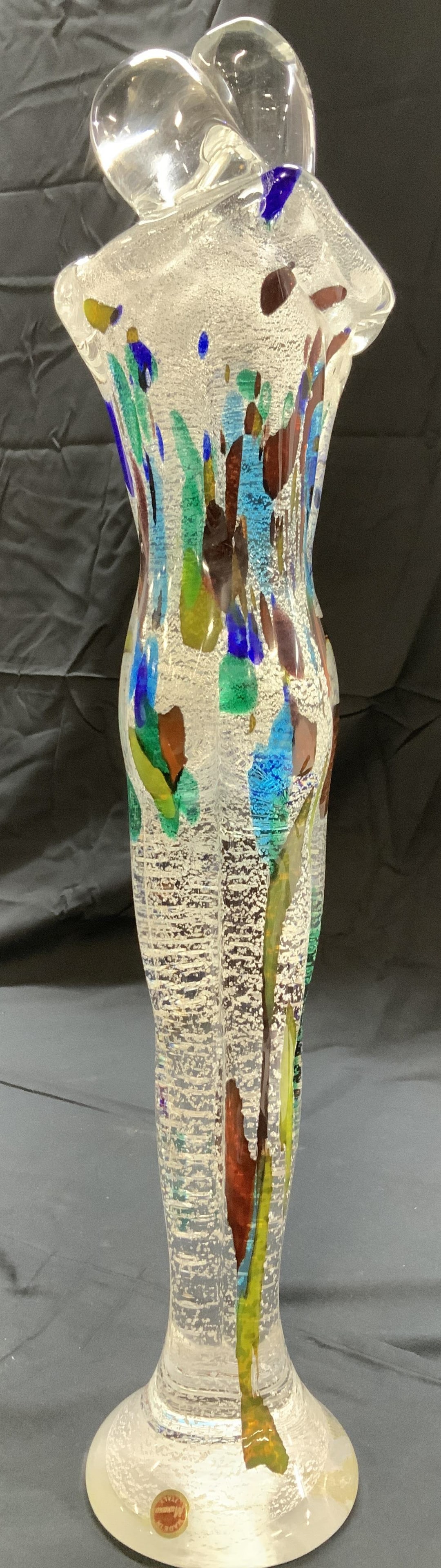 Vintage MURANO Glass Sculpture, Embracing Couple: 22 in. Tall Blown Murano glass sculpture of a nude embracing couple., spectacled with silver and accented with a bit of color. Mostly clear glass. Sticker label reads Made in Murano Italy. 4 in. Wide.