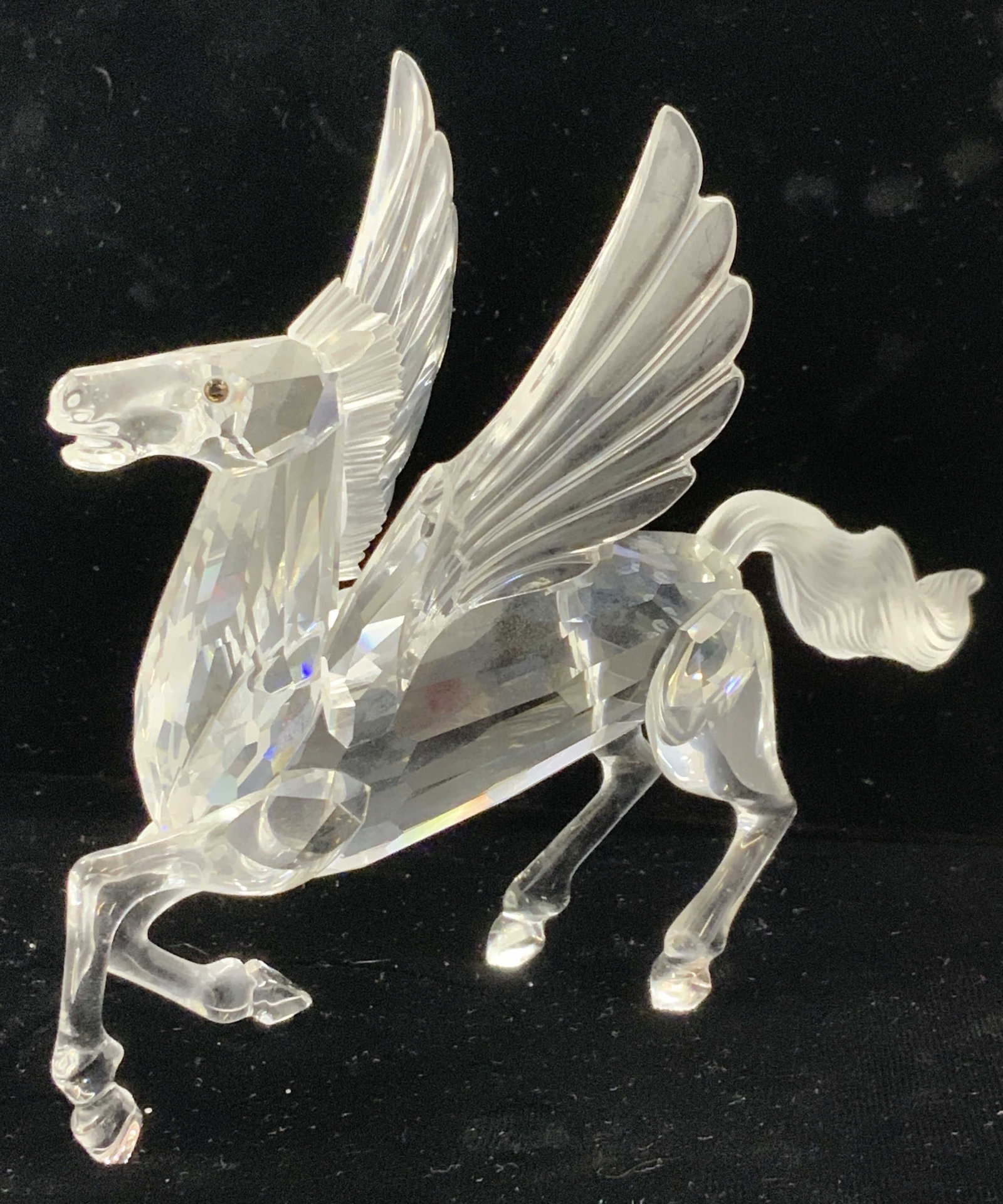 Swarovski Fabulous Creatures Crystal Pegasus, 1998: Swarovski Fabulous Creatures collection, PEGASUS, trademarked on verso with additional marking 98 AS. 6 in. Long x 4.5 in. HT x 2.75 in. W. Faceted body , amber eyes and frosted crystal tail and mane.