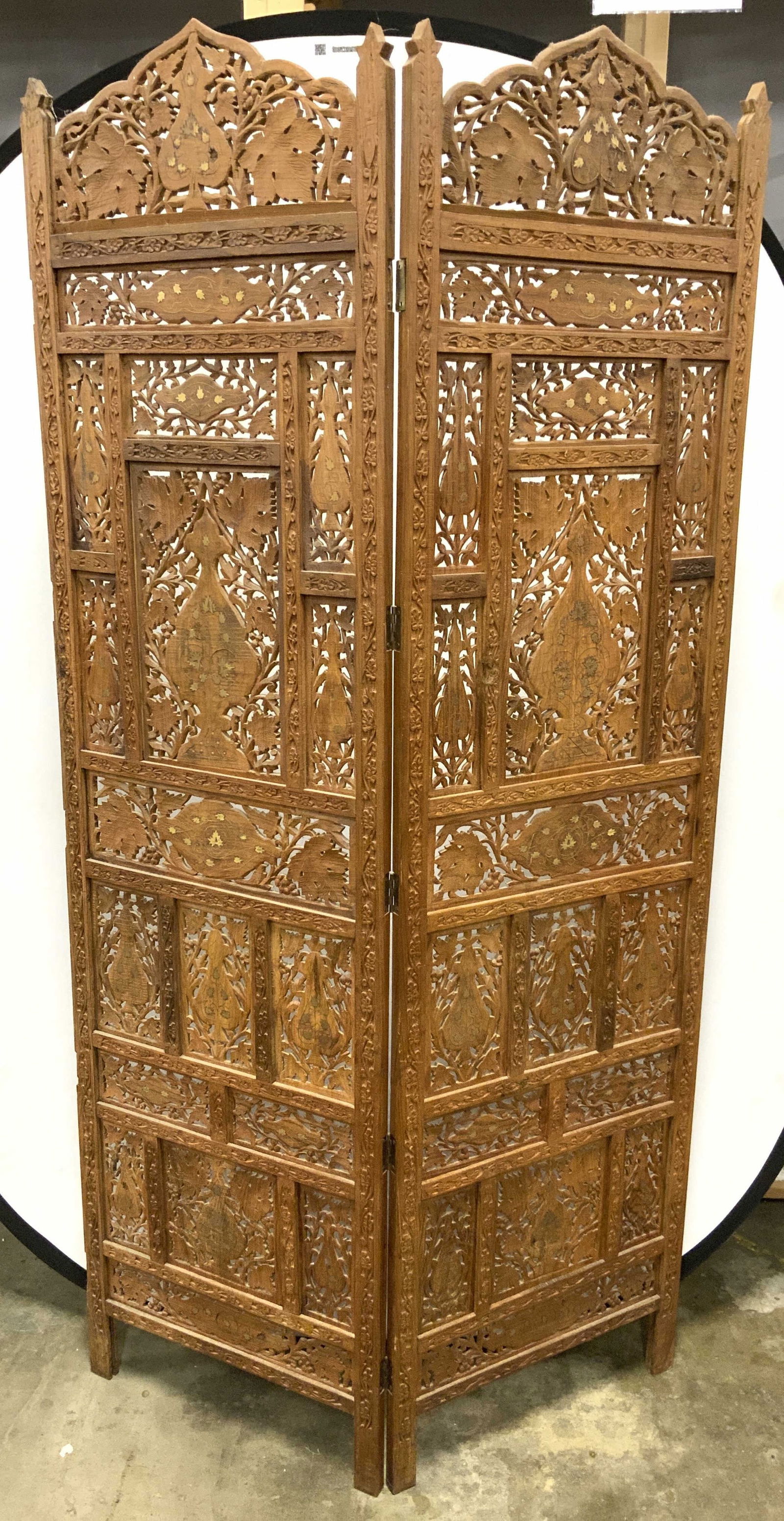 Vintage Wooden Moorish Room Divider: ,Moorish room divider. Piece is vintage and wooden. Divider is tan toned and wooden. Piece has intricate gilt metal inlay, bone inlay detail & pierced detail piece has vine and leaf detail. Room divid