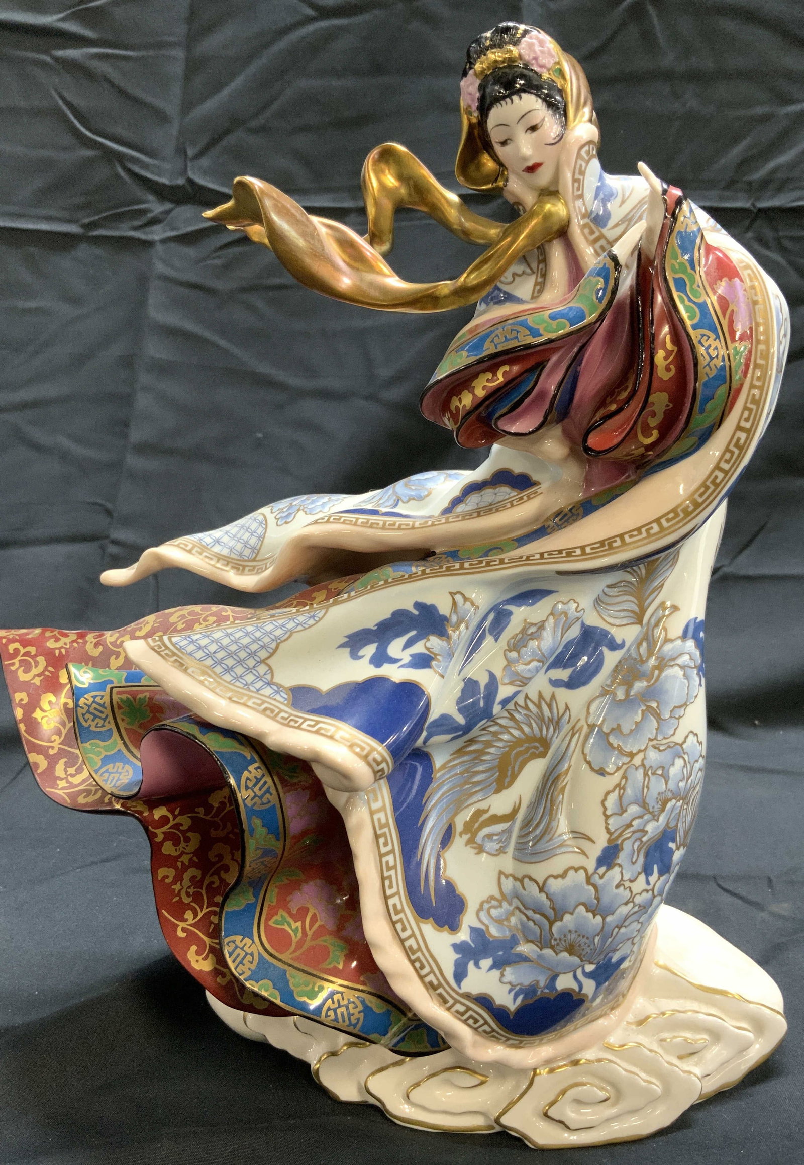 EMPRESS OF THE SNOW FRANKLIN MINT Porc Fem Fig: Underside reads EMPRESS OF THE SNOW THE FRANKLIN MINT LTD EDITION NO MT706. Piece depicts a female figure in traditional Asian dress flowing in wind. Piece has intricate multi toned floral, vine and l