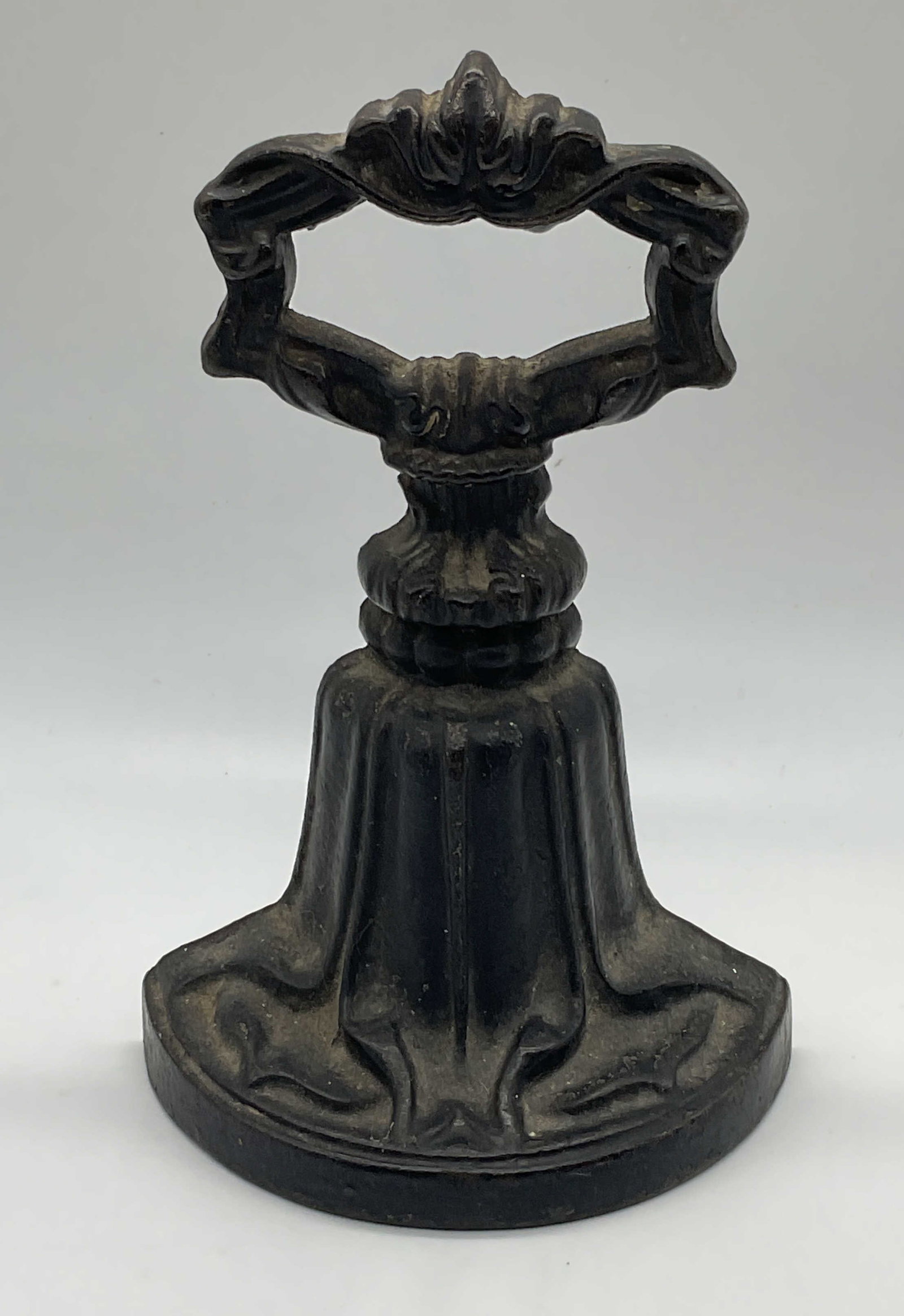 Antq Archibald Kenrick Cast Iron Bell Doorstop: Antique Archibald Kenrick and Son cast iron bell motif doorstop. Signed to reverse. Piece is heavy. Measures approx. 5 x 2.5 x 7.5 inches. Surface wear including scratching and loss to paint observed.