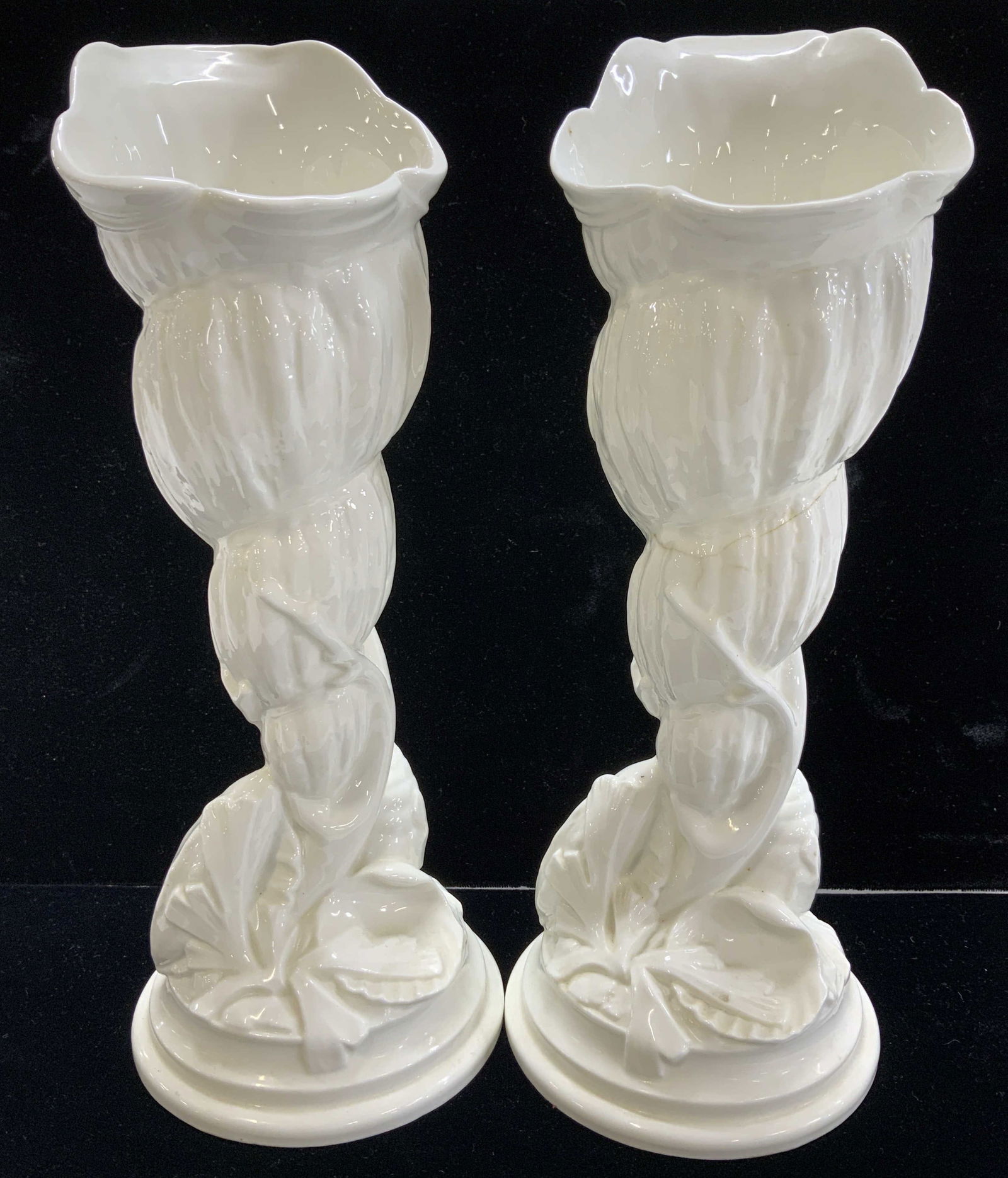 Pair Royal Worcester Bone China Vases, England: All white fine bone China vases stamped Royal Worcester # 2351- Made in England. Measure 9 in. Ht. x 3 in. Wide with a 3.75 in. round base. Shell and seaweed with shell - shape vase. Long crack on one