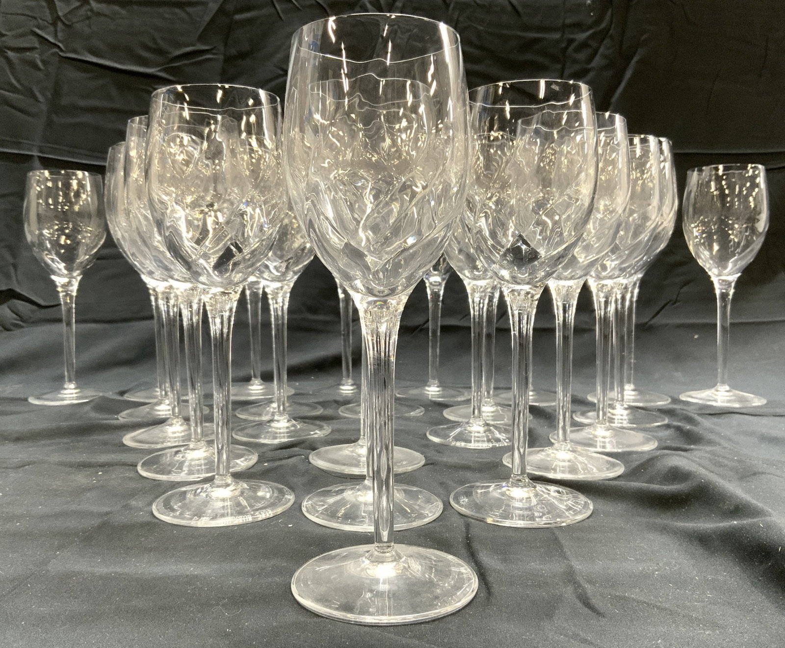 DMR MURANO Set 24 Crystal Stemware Wine Glasses: Undersides are signed DMR MURANO 2007. Lot includes 11 larger glasses & 13 smaller glasses. Each piece appears to be crystal. Larger glasses measure approximately 10 inches tall 3.25 inches wide. Wine