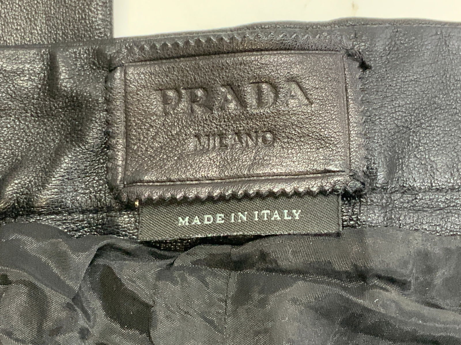 PRADA MILANO Black Lambskin Skinny Pants, Italy: Gently worn Signed Prada Milano Black Leather Skinny Pants. Size 36. 100% lambskin. Has 7% Stretch. Side zipper. 39.25 in. Long, inseam is 27 in. Made in Italy clothing, Luxury Prada Milano Lambskin L