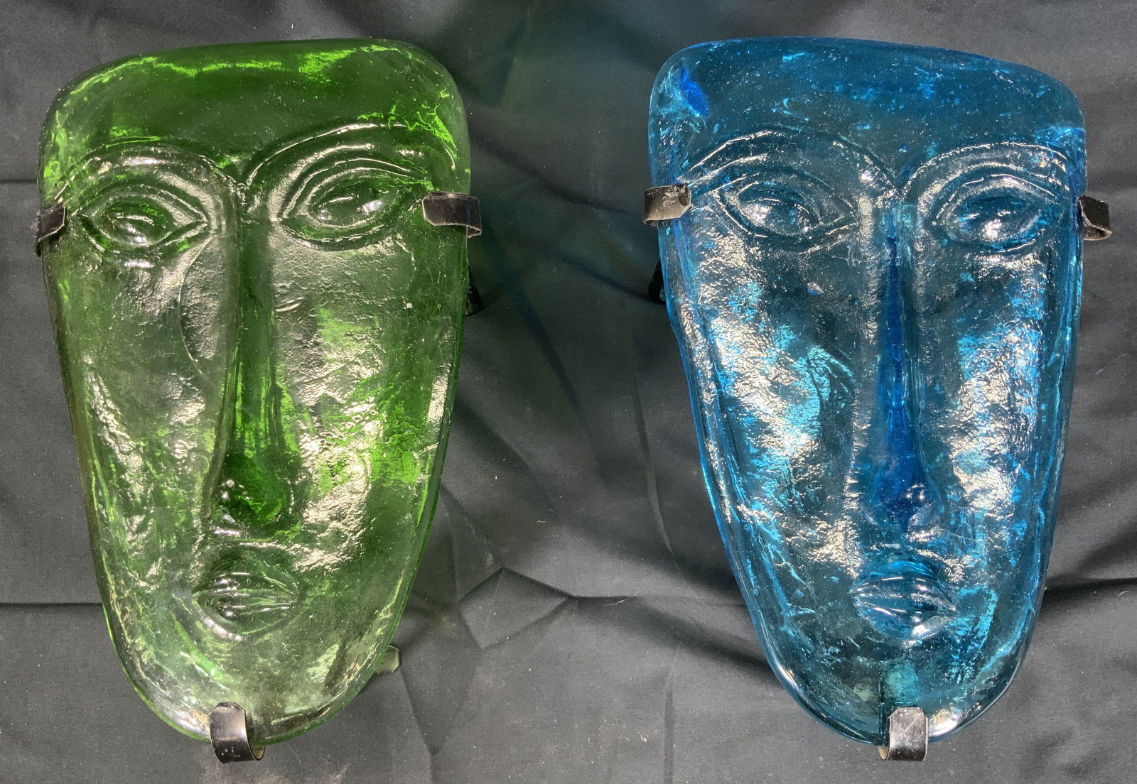 Pr Jaramillo Brothers Sky Dreamers Mask Sconces Mx: Vintage art glass. Made by Jaramillo Brothers. Green and blue sky dreamer mask candle sconces. Mask sconces measures approx. 7 W x 10 H x 4 D in. Metal scones have loop for hanging. Not viewed hanging