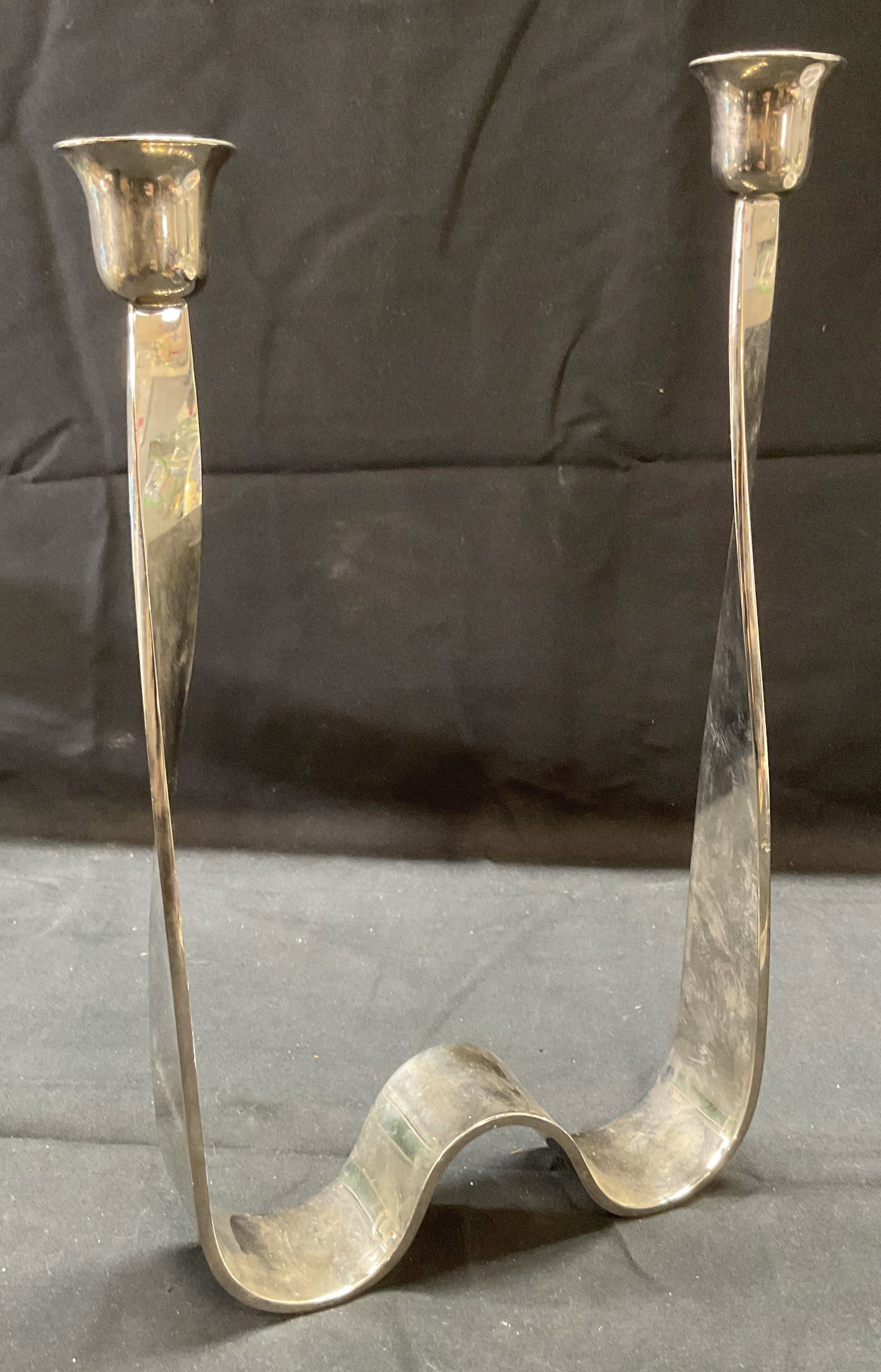 Guido Niest Silver Pl Double Candelabra, Italy: Guido Niest Atelier silver plated double arm candelabra. Twisted wave design. Signed on underside. Made in Italy. Measures approx. 6.75 x 1.5 x 12.25 inches. Some surface wear including scratching and