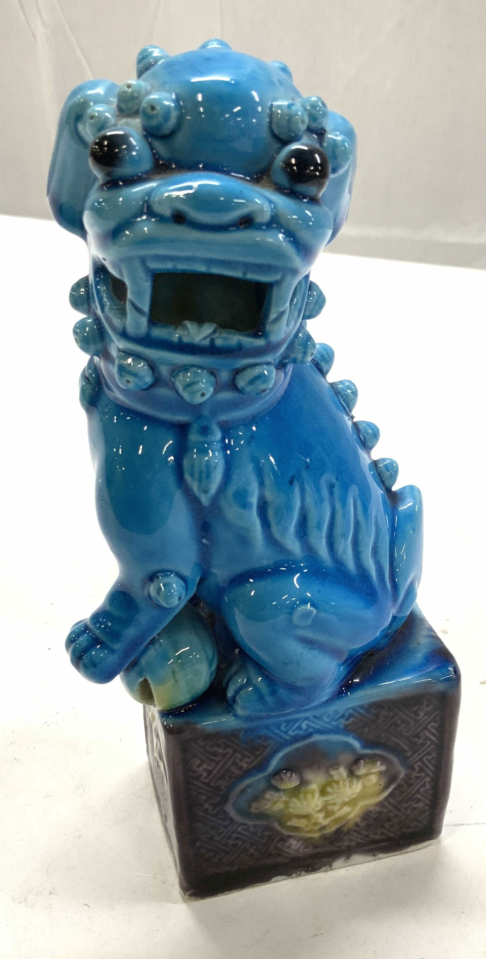 Chinese Guardian Dog Porcelain Statue: Hand painted vintage porcelain fu dog, painted a bright blue and glazed. The make fu dog has his paw resting on a ball. Measures 7.75 in. Ht x 3.5 in. Wide. Chinese Cizhou statue, Chinese Porcelain Fu