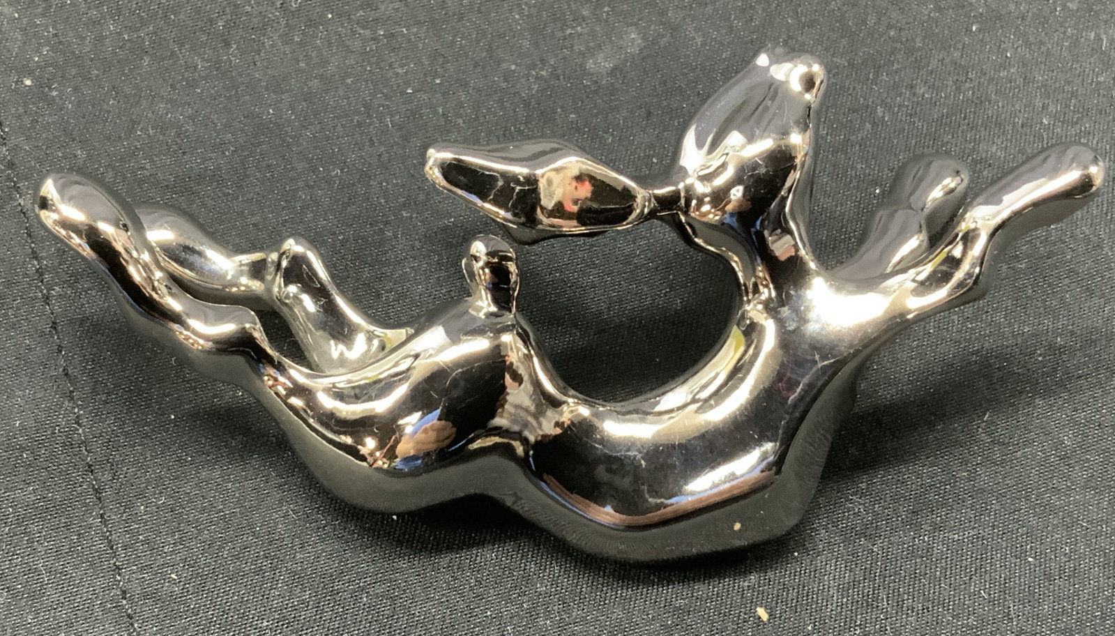 Silver Plate Rabbit Figural Chopstick Rest: Trademarked silver plate rabbit Figural . Chopstick rest or can be used as other decor. Measures 3 in. Ht x 1.25 in. Wide. Trademark is between the front legs. Rabbit chopstick rest, tableware accesso