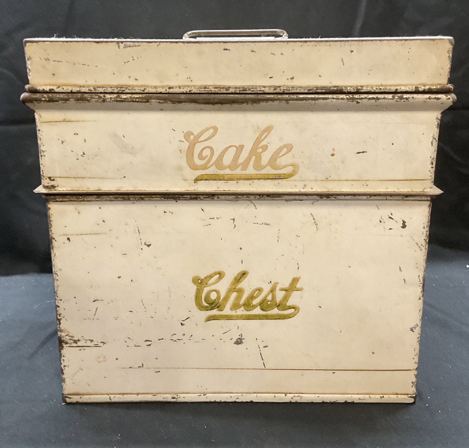 Vintage Two Piece Toleware Cake Chest Tin: Vintage two piece toleware cake chest tin. Labeled Chest and Cake. Trademarked K to undersides. Total dimensions approx. 10.5 x 10.5 x 10.5 inches. Surface wear including scratching and loss to paint 
