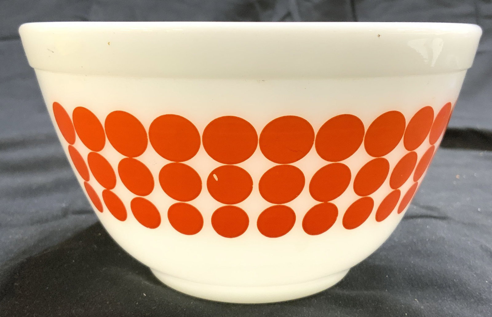 PYREX Vntg Glassware Bowl White & Orange USA: Underside reads PYREX MADE IN USA. Bowl is white with orange toned dot detail. Pyrex bowl is glass. Outer rim has lip. Vessel measures approximately 5.75 inches wide 3.25 inches tall. Bowl, glass bowl