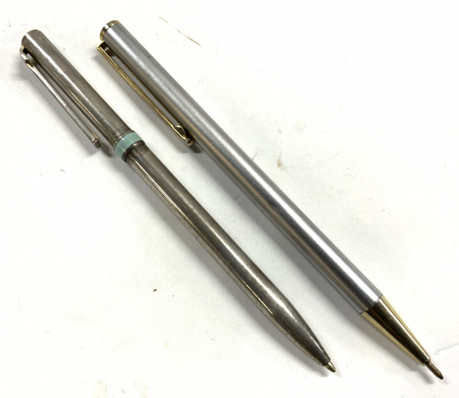 TIFFANY & CO Sterling Silv & FENDI Pen: Lot includes 1 pen inscribed TIFFANY & CO STERLING & 1 pen inscribed FENDI. FENDI pen is silver toned with gilt metal accents. FENDI pen measures approximately 5.25 inches long. Tiffany & co pen weigh