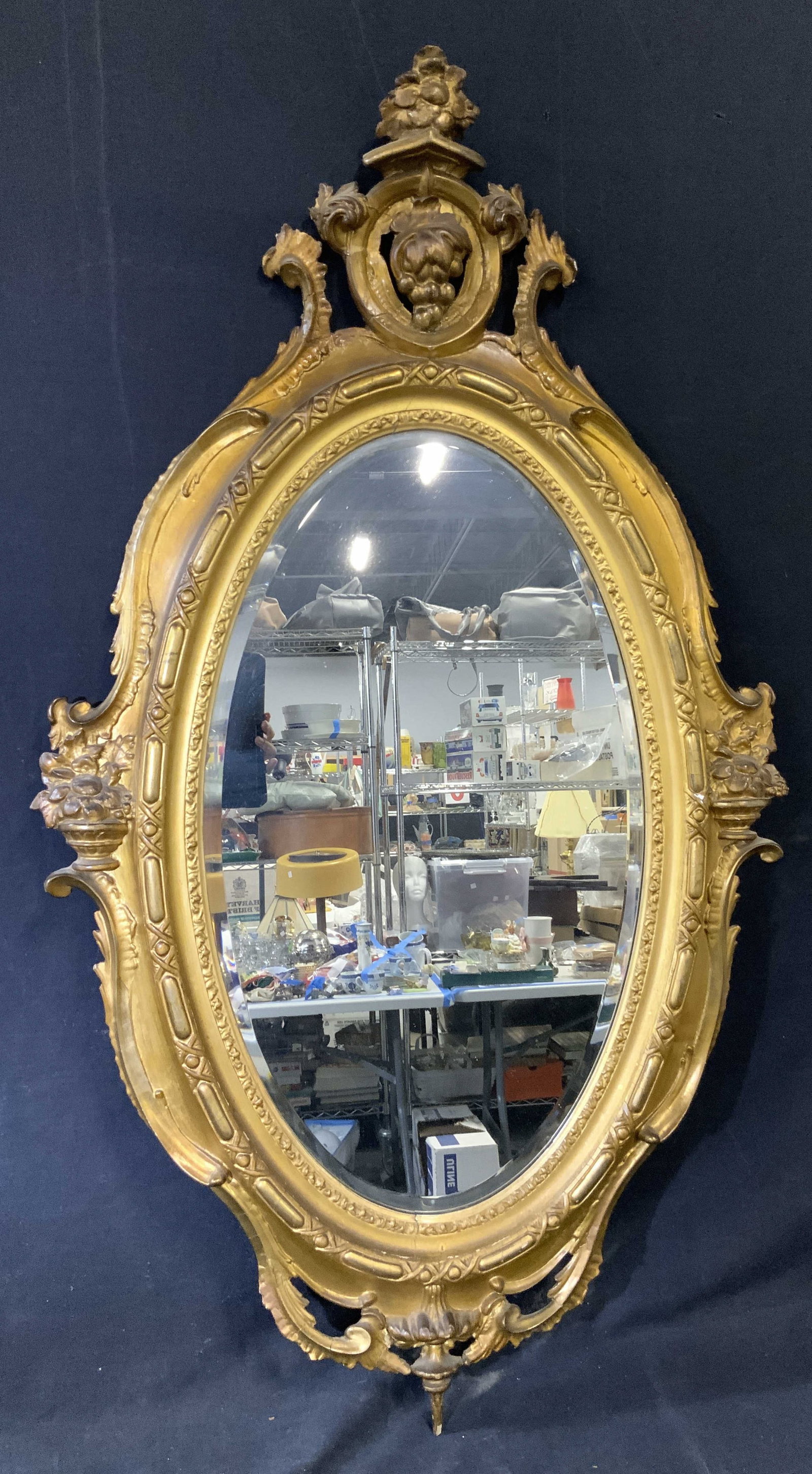 Vntg Victorian Giltwood Beveled Wall Mirror: Mirror has Giltwood frame. Piece is vintage. Mirrored surface is beveled. Piece has oval form. Mirror has scroll & leaf detail. Measures approximately 46 inches tall 26 inches wide. Mirror, wall mirro