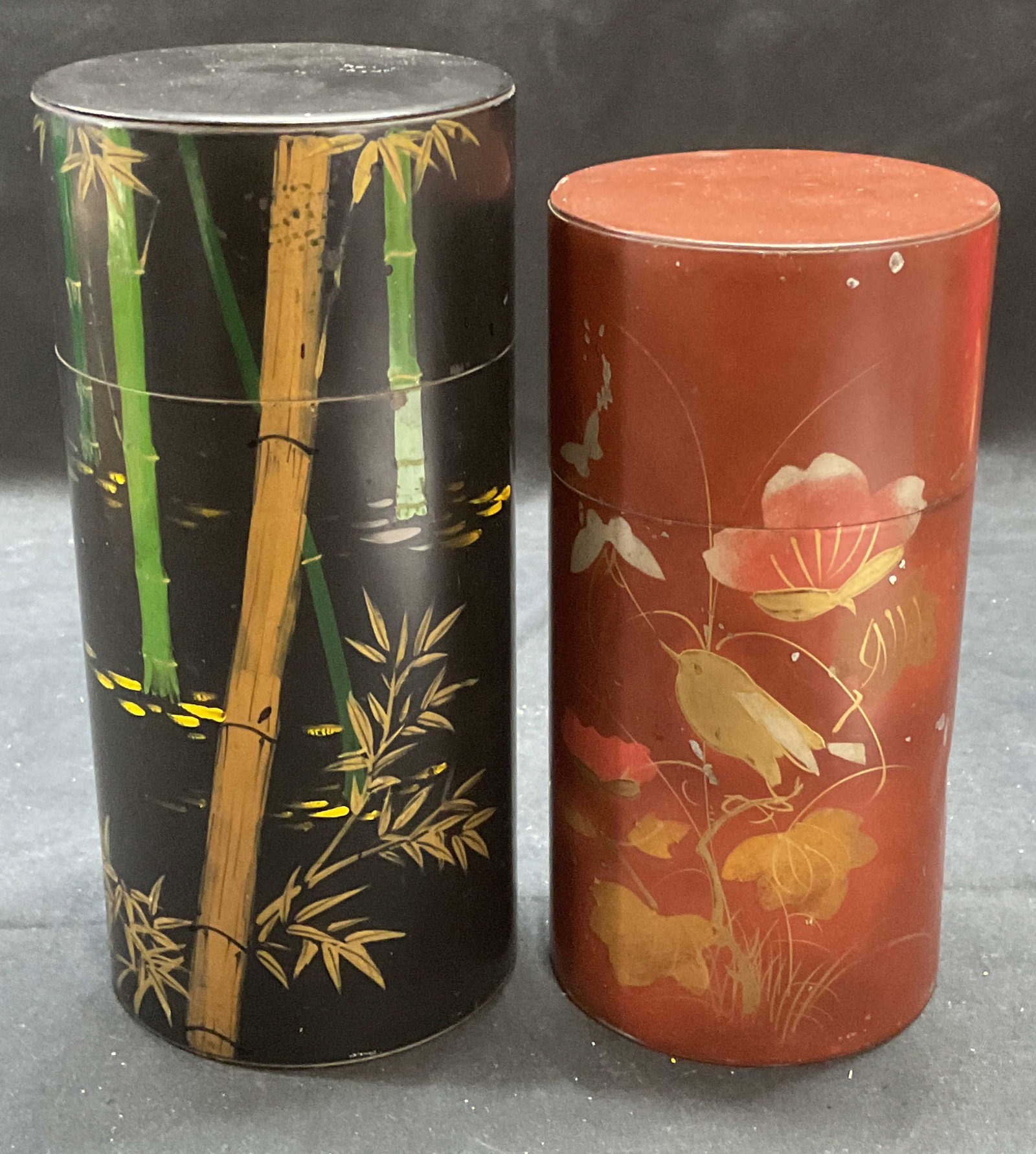 Pair Vtg Hand Painted Japanese Toleware Tea Tins: Pair of vintage hand painted Japanese toleware tea tins. Bird and bamboo motifs on red and black grounds. Gilt decoration to each. Larger tin measures approx. 3.5 x 7.5 inches. Both pieces have surfac