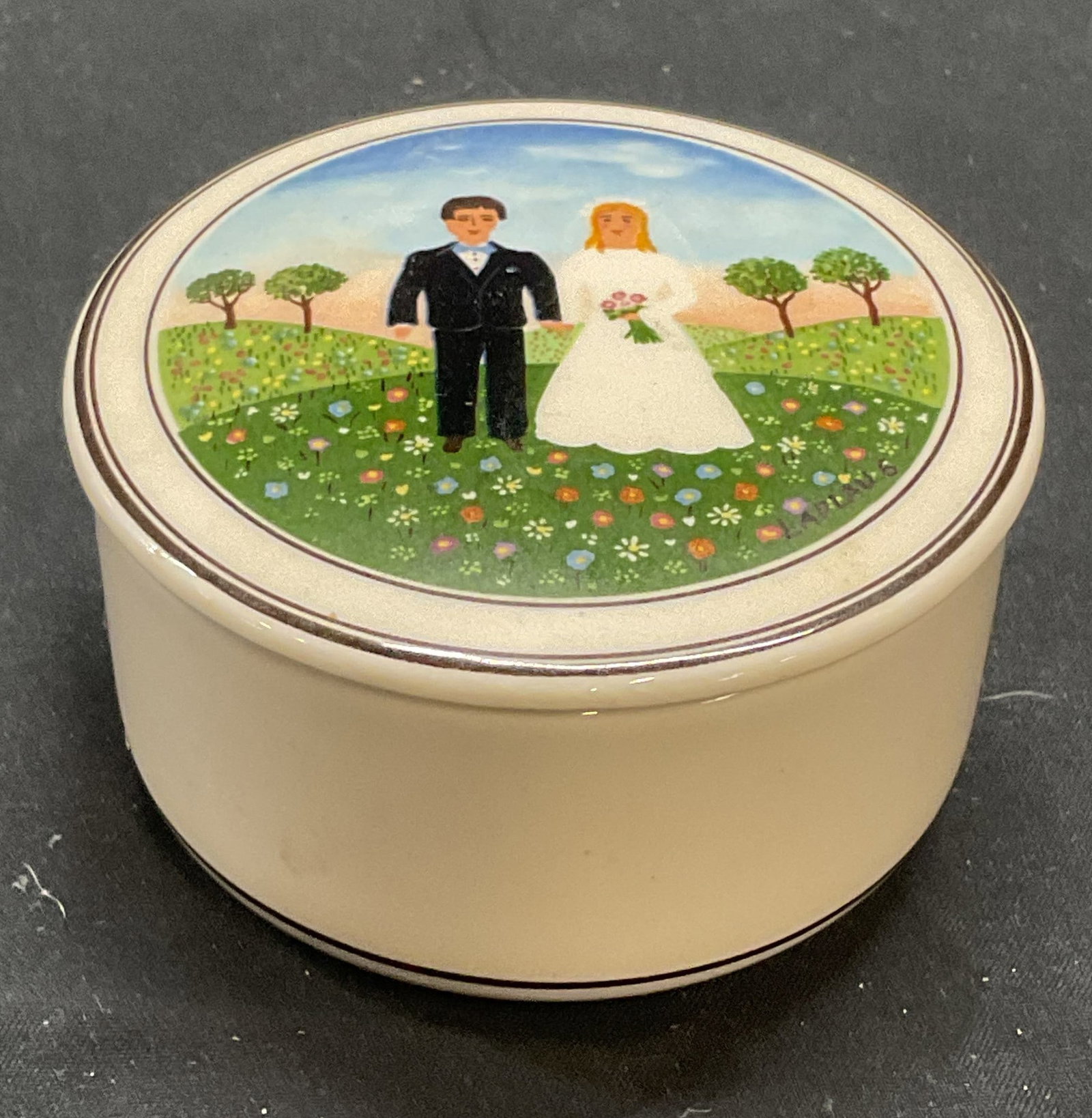 VILLEROY & BOCH Porcelain Naif Wedding Box: VILLEROY and BOCH porcelain lidded trinket box with wedding couple motif. Marked design Naif and signed VILLEROY and BOCH to underside. Measures approx. 3 x 1.5 inches. Some surface wear including scr