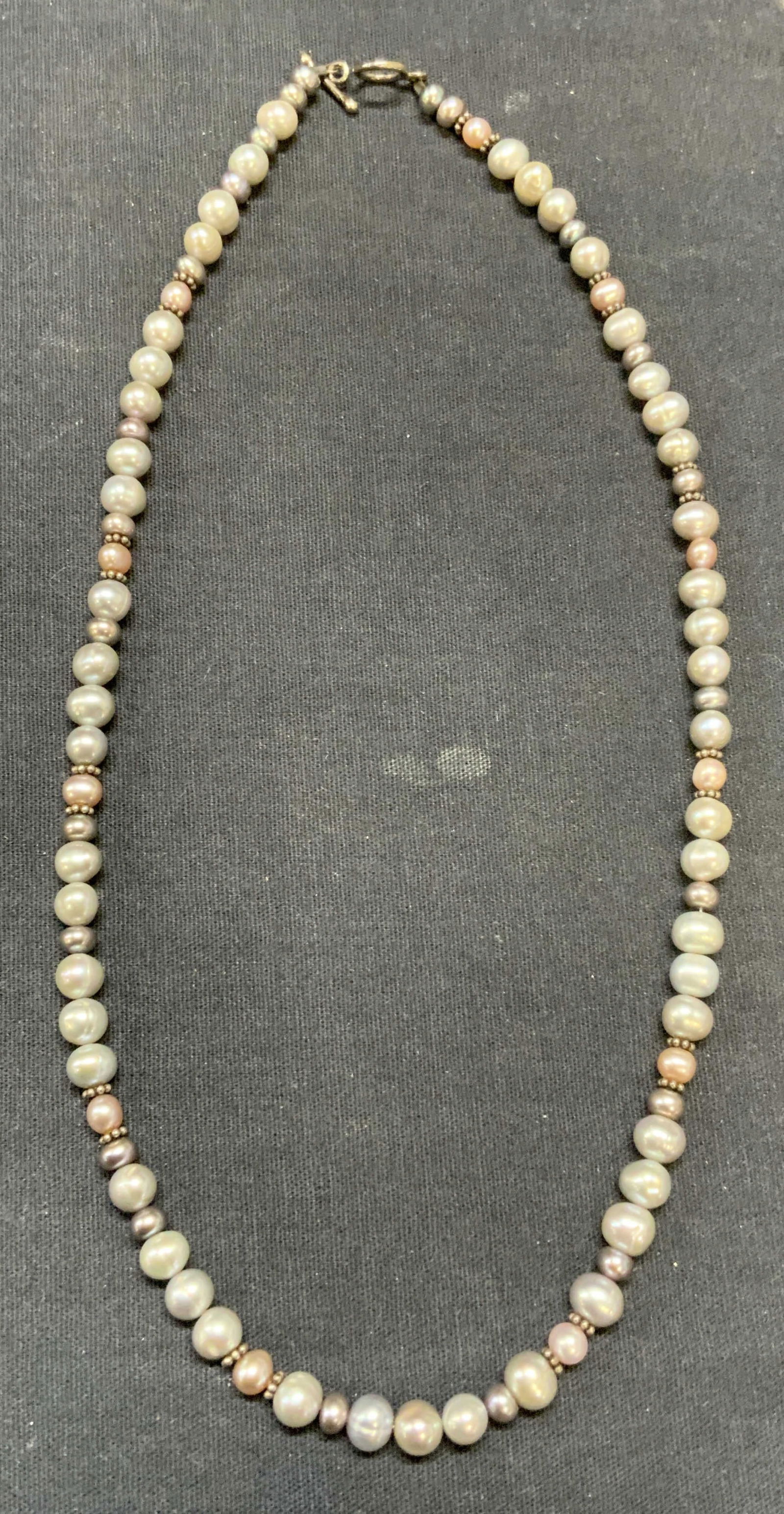 Vintage Pearl & Sterling Silver Necklace: Vintage pale pink and blue toned beaded pearl necklace with sterling silver clasp and accent beads. Test for sterling using PuriTEST kit. Drop length approx. 8.75 inches. Total weight 27.4 grams. Some