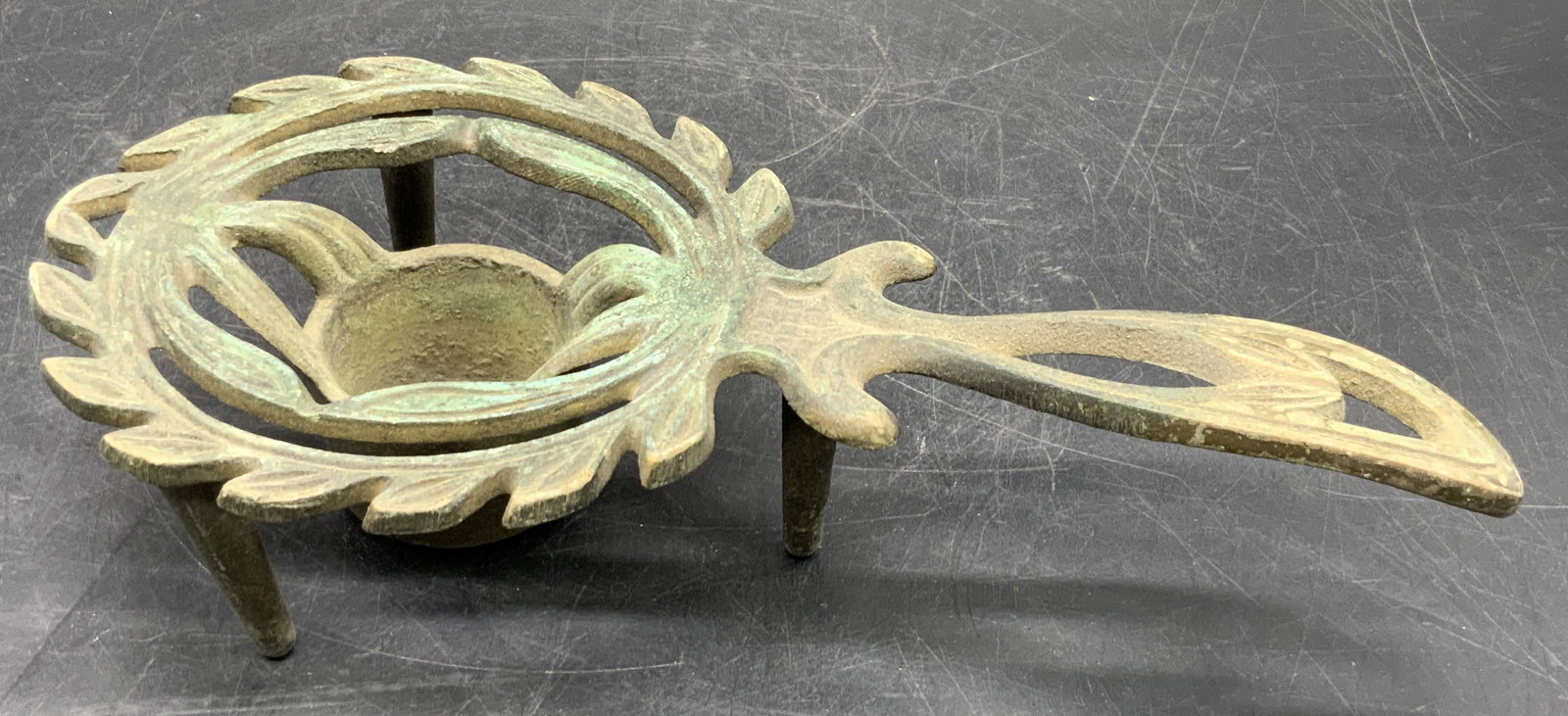 Vintage Metal Candle Holder Trivet, Israel: A vintage metal candle holder trivet. Measures approx. 2H x 9.25W in. Underside reads MADE IN ISRAEL. Patina present. Surface wear consistent with age, use, and exposure. Collectibles, decorative obje