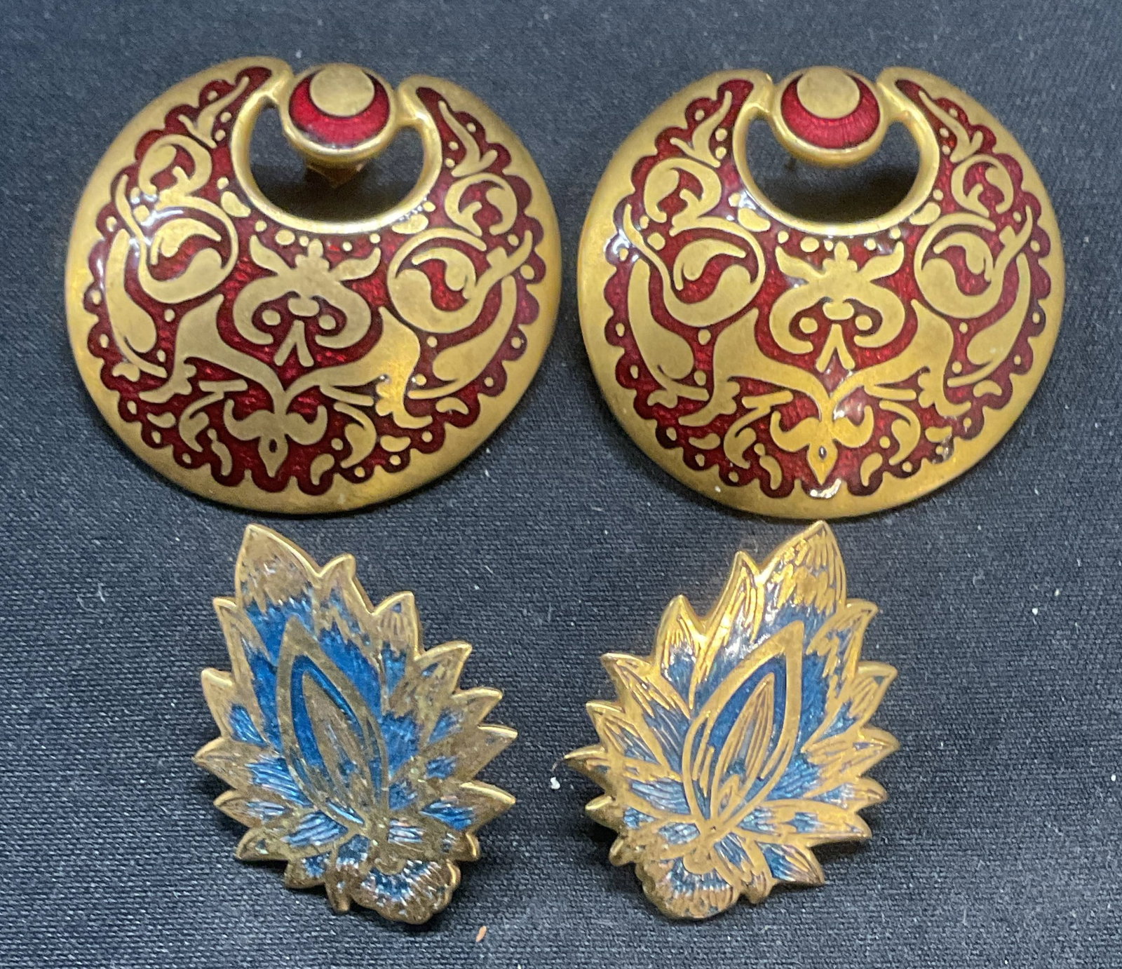 Lot 2 Vntg MMA Gold Plated & Enamel Earrings: Vintage Metropolitan Museum of Art gold plated and enamel decorated earrings. One pair with abstract red motif and one pair with blue Mughal flower motif. Signed to undersides, dated 1985/1982. Both p