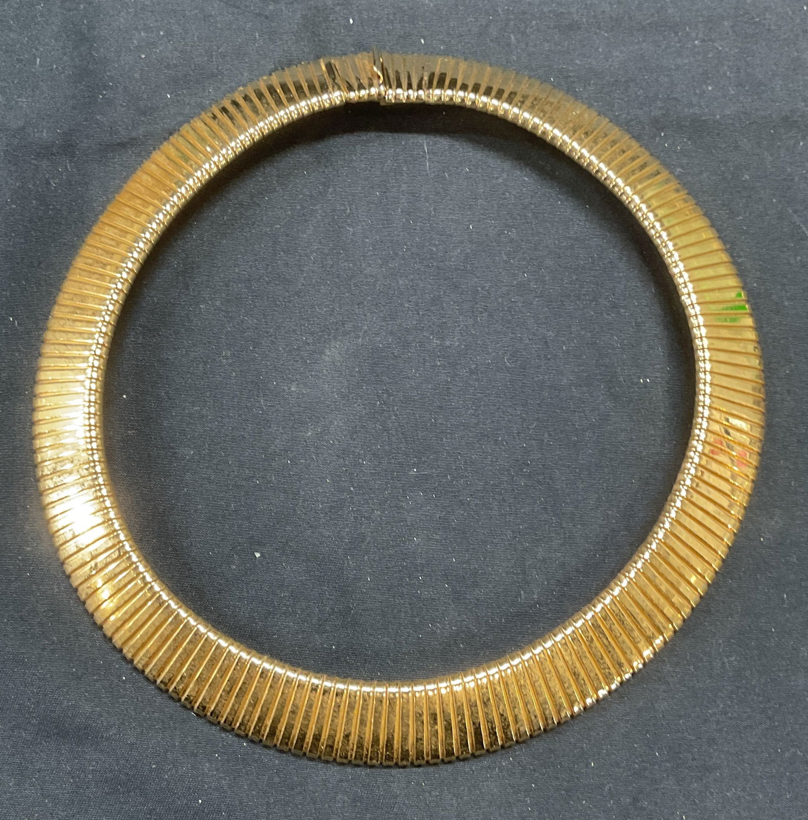 Vintage Ciner Gold Tone Choker Necklace: Vintage Ciner gold tone accordion choker necklace. Signed on clasp. Measures approx. 4.75 inches wide. Some surface wear including scratching observed. Jewelry, estate jewelry, costume jewelry, cockta