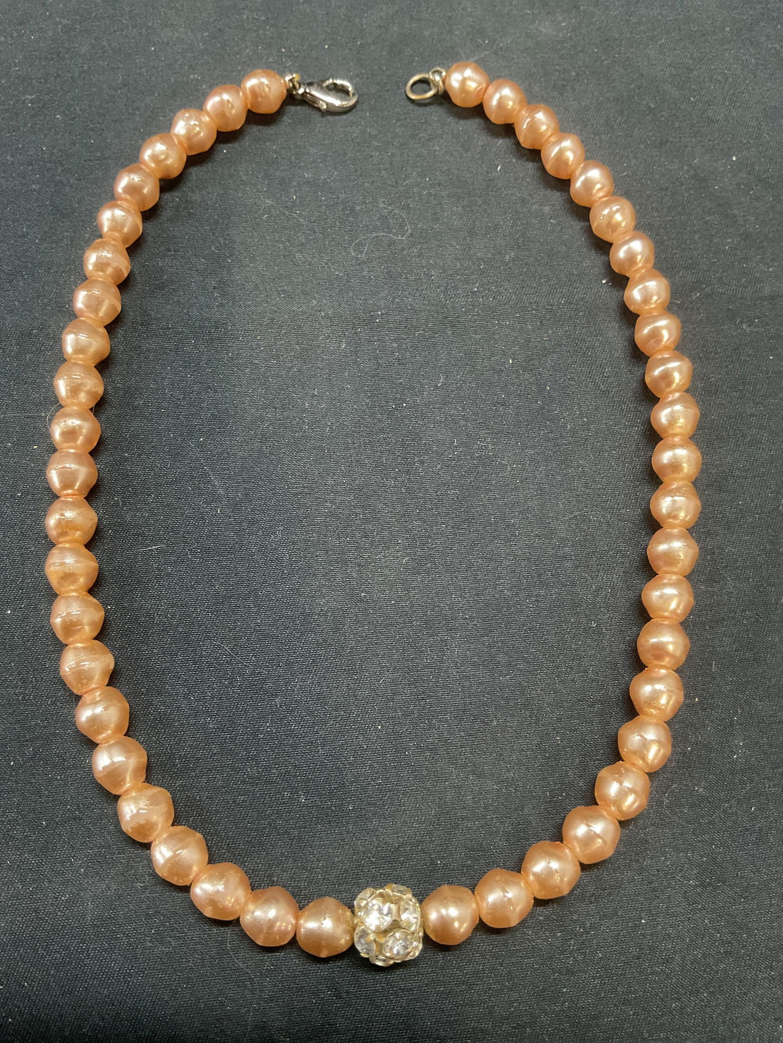 Faux Champagne Pearl & Crystal Necklace: Faux champagne toned pearl beaded choker necklace with crystal accent. Drop length approx. 7 inches. Includes jewelry pouch. Some surface wear including scratching observed. Jewelry, estate jewelry, c