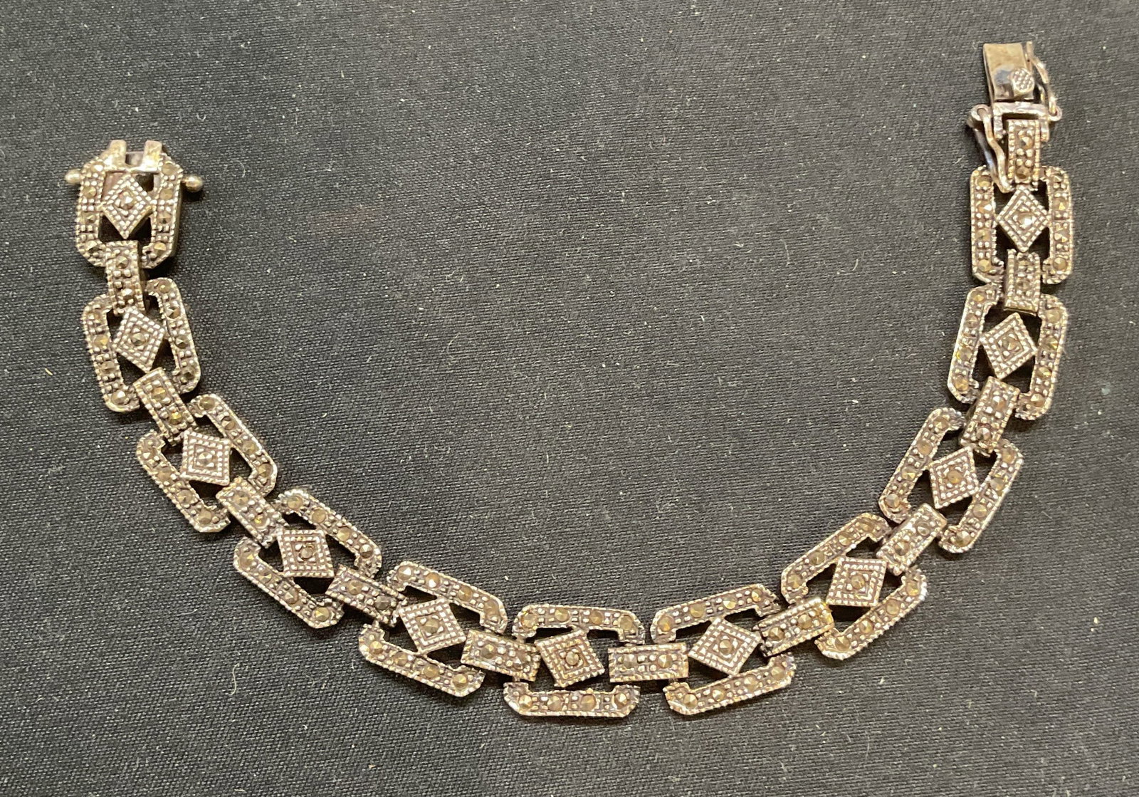 Vintage 825 Silver Marcasite Bracelet: Vintage 825 silver bracelet with marcasite decorated panels. Marked 825. Measures approx. 7 inches long. Total weight .77 ozt. Some surface wear including scratching observed. Jewelry, estate jewelry,