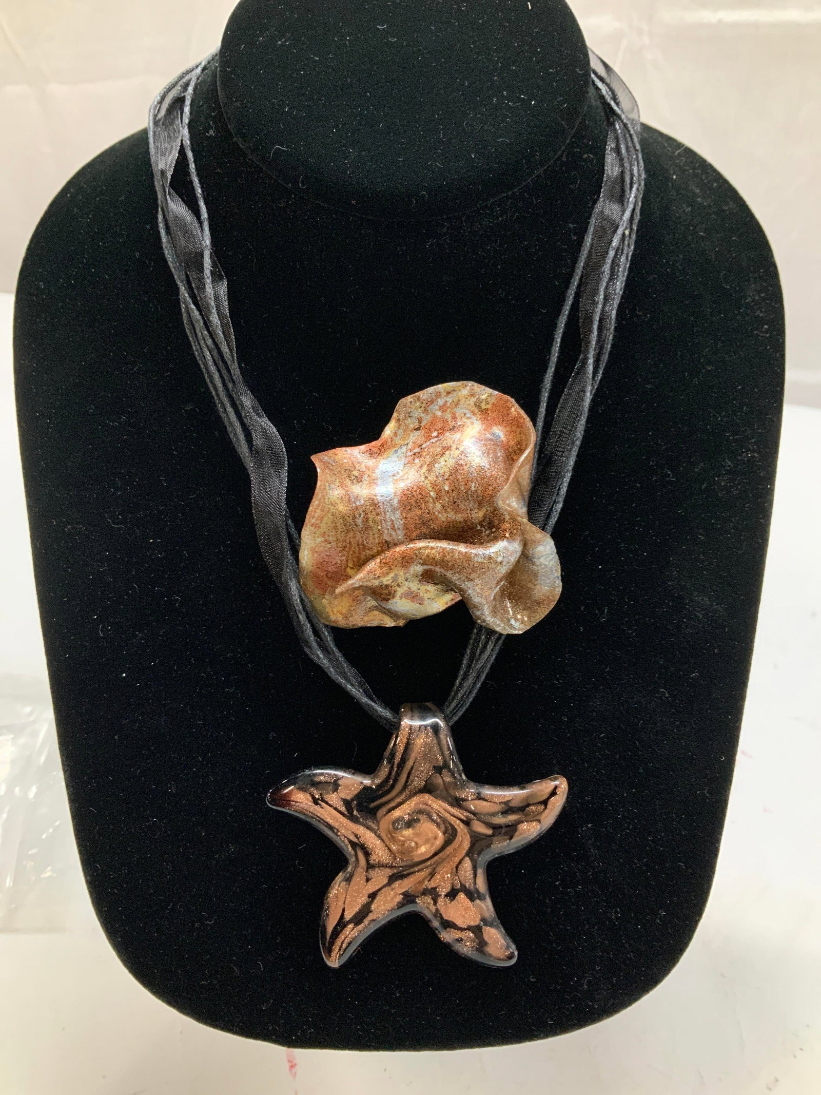2 Hand Crafted Glass Pendant Neck., Brooch: Starfish art glass pendant necklace on black satin ribbon and cords. Adjustable length. Starfish measures 2 in. 7.25 in. max drop. New on package hand crafted sculptural brooch with metallic coating. 