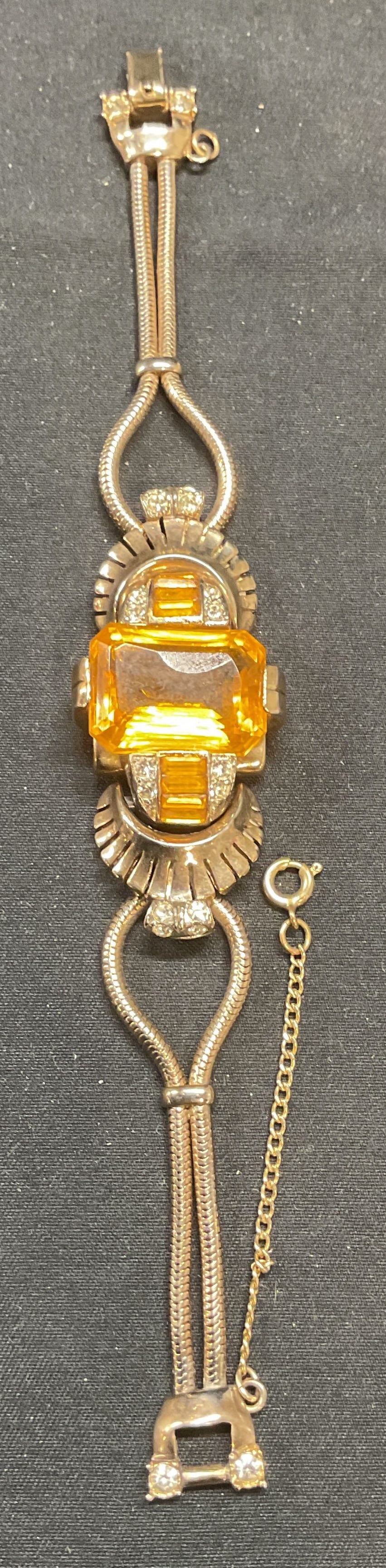 Vintage Gold Tone Yellow Crystal Bracelet: Vintage gold tone bracelet with yellow and colorless crystal decoration. Measures approx. 6.5 inches long, 8 inches with extender chain. Some surface wear including scratching observed. Jewelry, estat