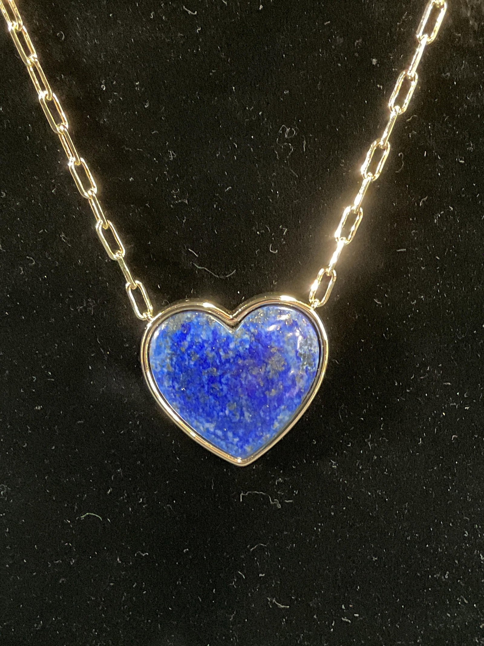 CCC Gold Tn Lapis Heart Pendant Necklace: Signed CCC gold tone necklace with heart shaped lapis stone pendant. Signed on hang tag. Drop length approx. 10 inches. Pendant measures approx. 1.25 x 1.5 inches. Some surface wear including scratchi