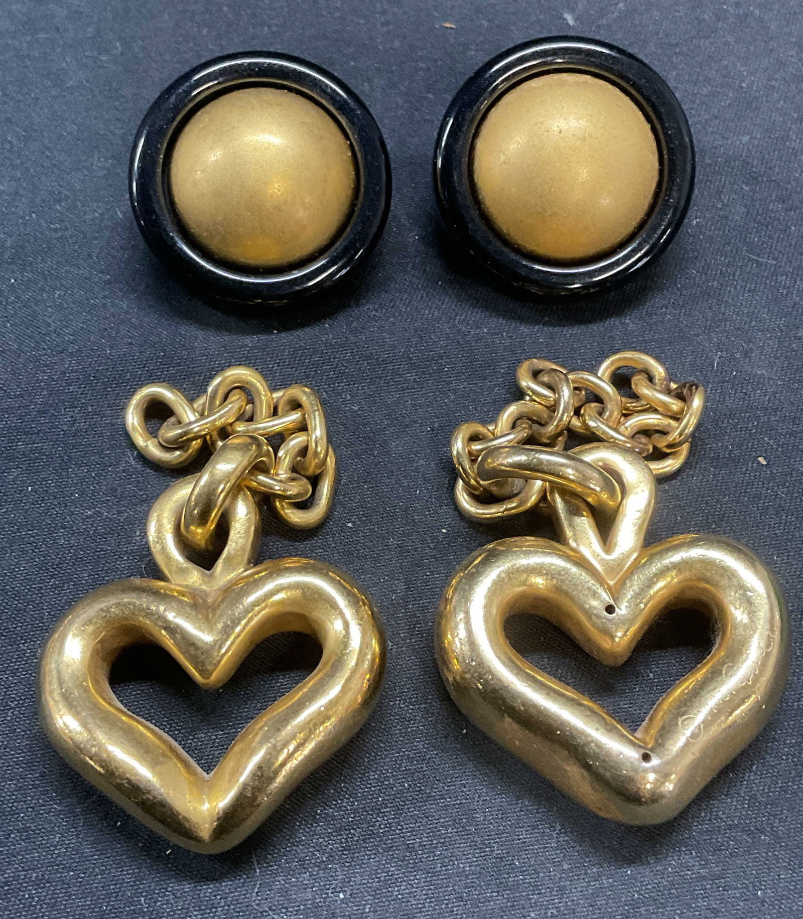 Lot 3 VAUBEL Gold Vermeil Heart Pendants +: Lot of 3 jewelry pieces. 2 vintage 1992 VAUBEL Gold vermeil heart pendants on chains. Pendants measure approx. 1.25 x 1 inches each. One piece signed. Black and gold tone round stud clip on earrings. 