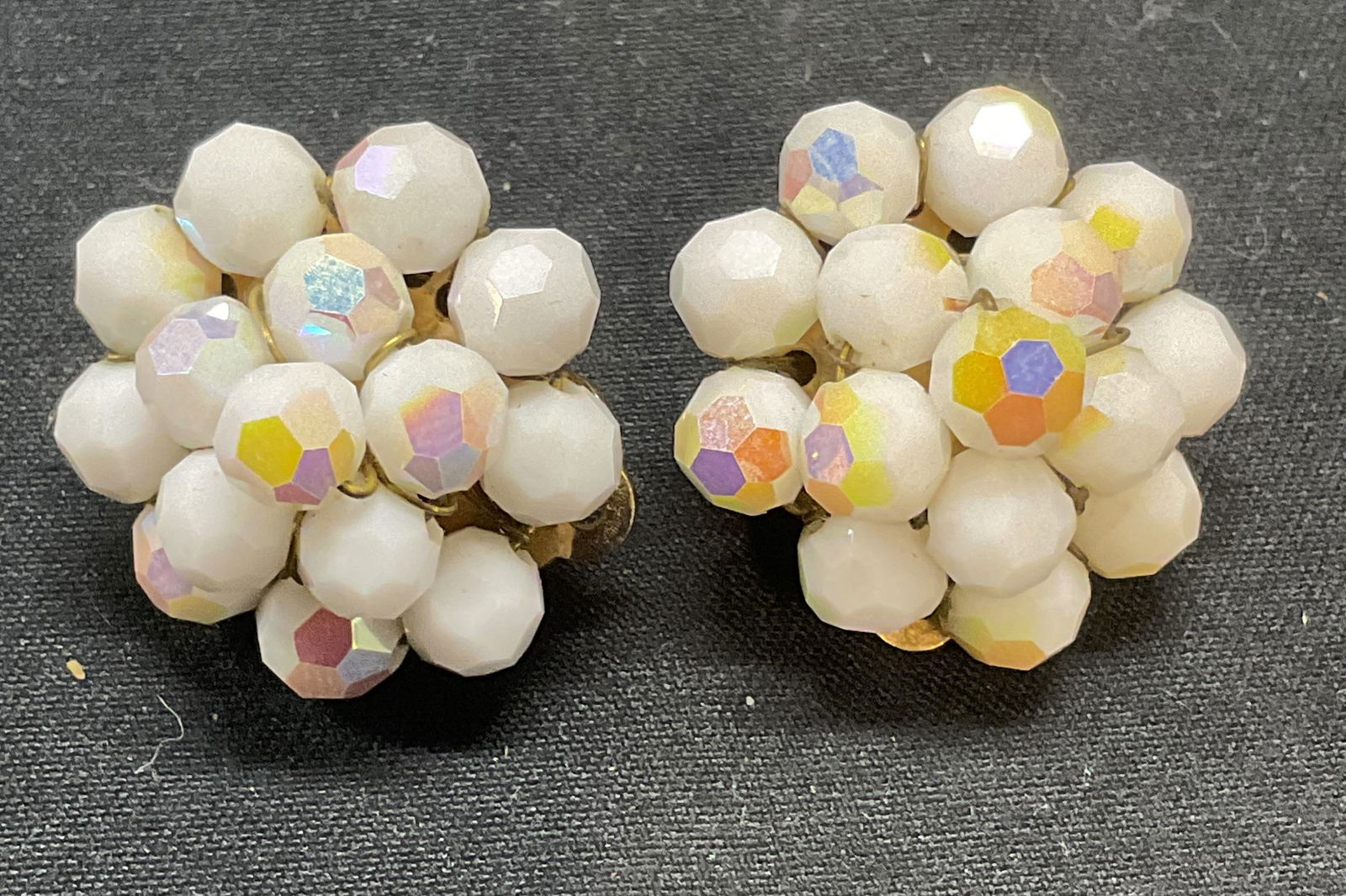Vintage Les Bernard White Crystal Earrings: Vintage Les Bernard white crystal beaded clip on earrings. Signed in backing. Measure approx. 1 inch diameter. Some surface wear to all pieces including scratching observed. Jewelry, estate jewelry, c