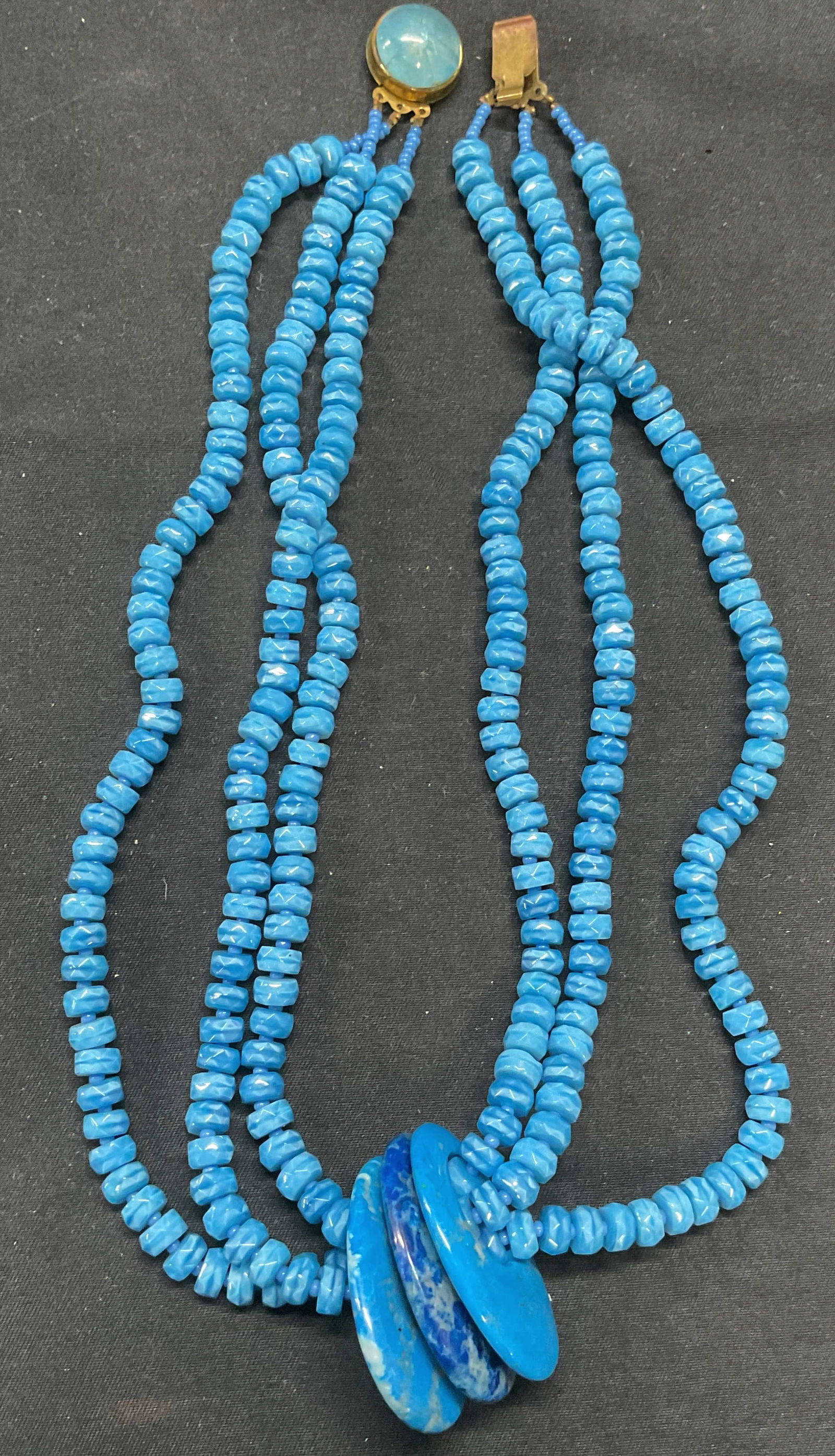 Vntg Blue Stone Multi Strand Pendant Necklace: Vintage blue stone beaded multi strand pendant necklace. Drop length approx. 7 inches. Some surface wear including scratching observed. Jewelry, estate jewelry, costume jewelry, cocktail jewelry, fash