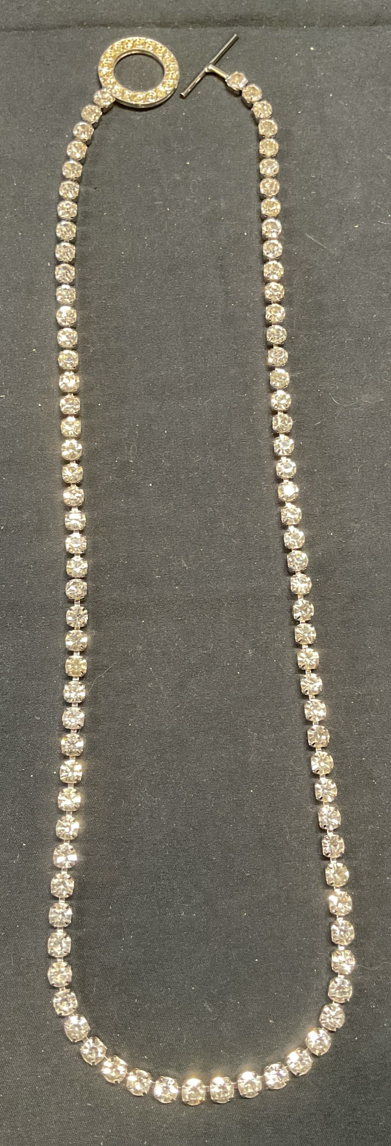 Vintage Silver Tone Crystal Necklace: Vintage silver tone necklace with colorless crystal decoration. Drop length approx. 14 inches. Some surface wear including scratching observed. Jewelry, estate jewelry, costume jewelry, cocktail jewel