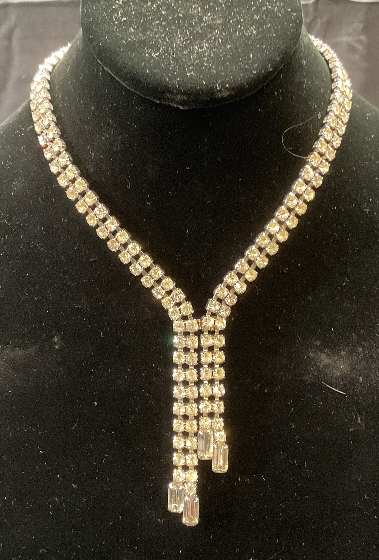 Vintage Crystal Choker Pendant Necklace: Vintage silver tone choker pendant necklace with colorless crystal decoration. Drop length approx. 6.75 inches. Pendant measures approx. 2.5 inches long. Some surface wear including scratching observe