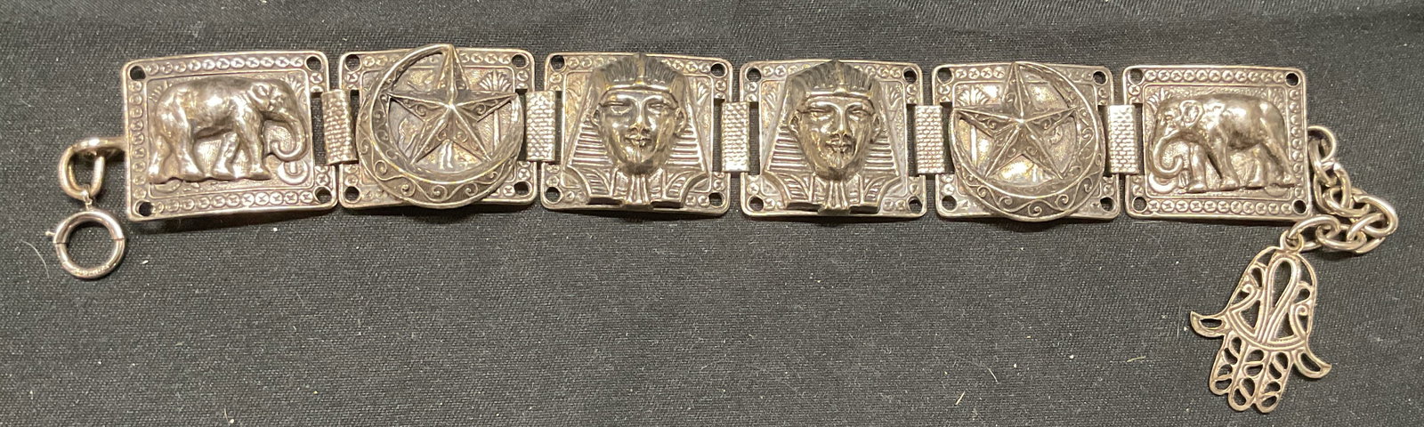 Signed 12k Gold Filled Egyptian Motif Bracelet: Vintage signed 12k gold filled bracelet with raised Egyptian motif panels. Pharaoh, elephant, moon and star. Marked 12k GF on clasp. Stamped with star and moon to underside. Measures approx. 8 inches 