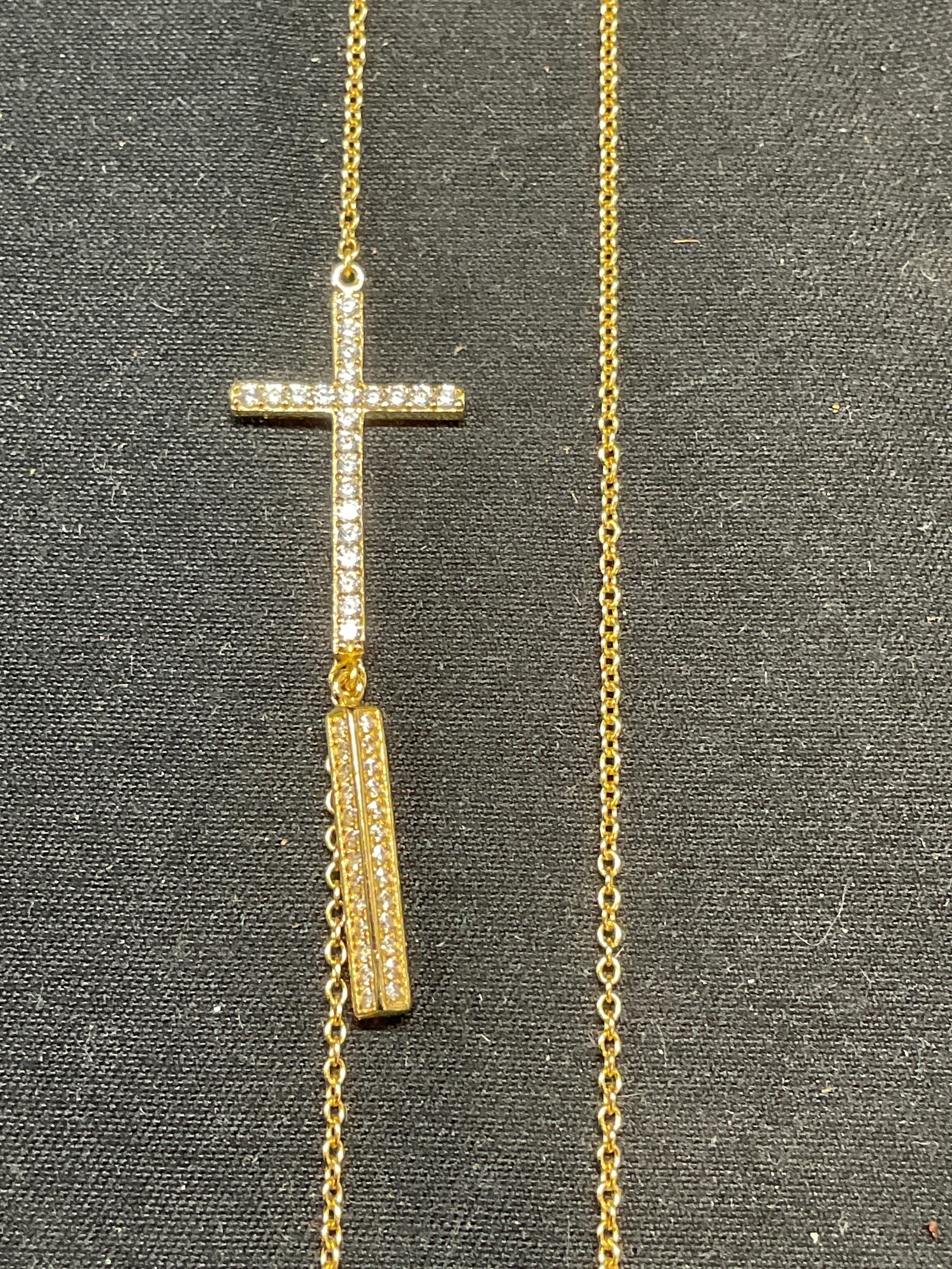 Sterling Silver Gold Pl Crystal Cross Necklace: Sterling silver gold plated necklace with colorless crystal decorated cross pendant. Marked 925. Drop length approx. 12.5 inches. Total weight 3.4 grams. Some surface wear including scratching observe
