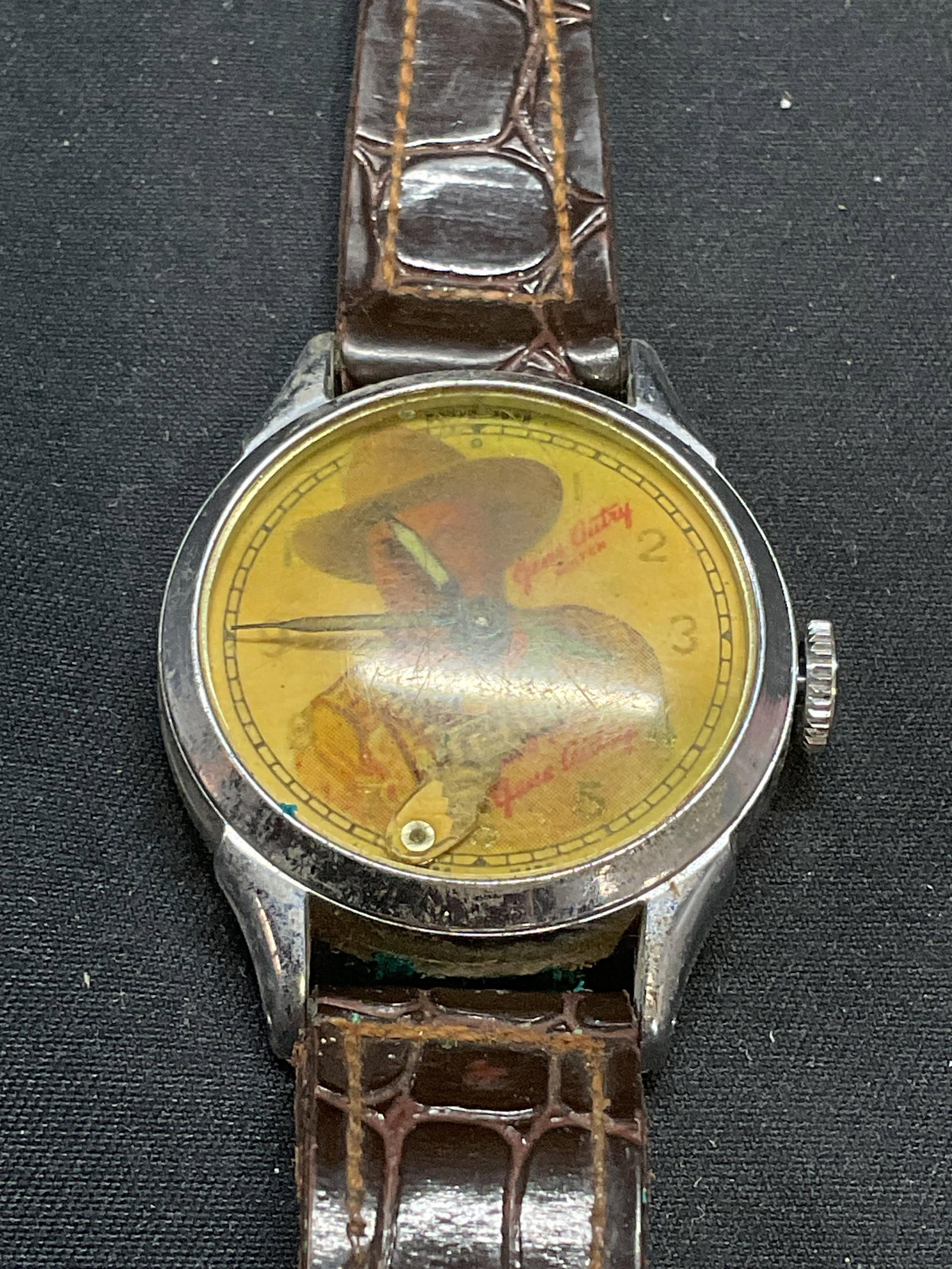 Vintage Gene Autry Always Your Pal Watch: Vintage Gene Autry Always Your Pal Watch with brown leather strap. Face features image of Autry with Gun motif watch hand. Measures approx. 7.5 inches long. Not tested for function. Some surface wear 