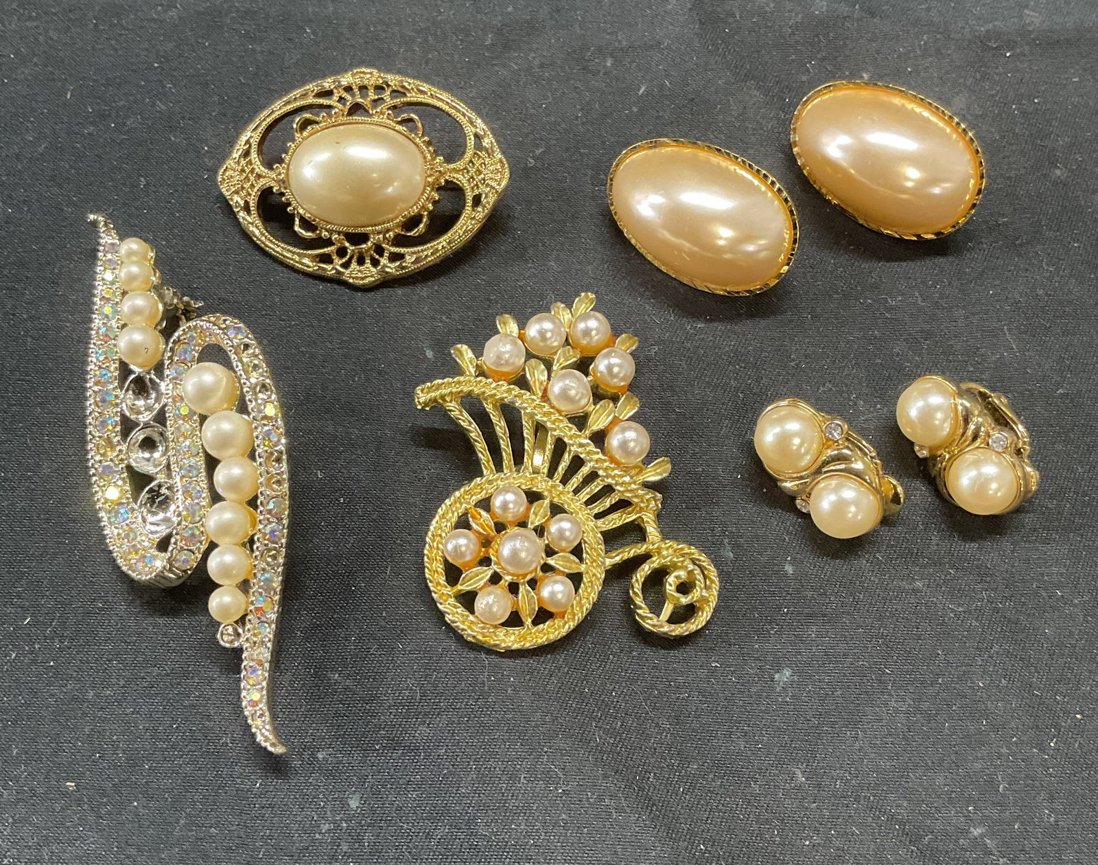Lot 5 Vintage Trifari Faux Pearl Earrings +: Lot of 5 jewelry pieces. Vintage Trifari gold tone faux pearl and crystal clip on earrings. Signed on backing. Measure approx. .75 inches long. Lot also includes gold tone faux pearl clip on earrings,