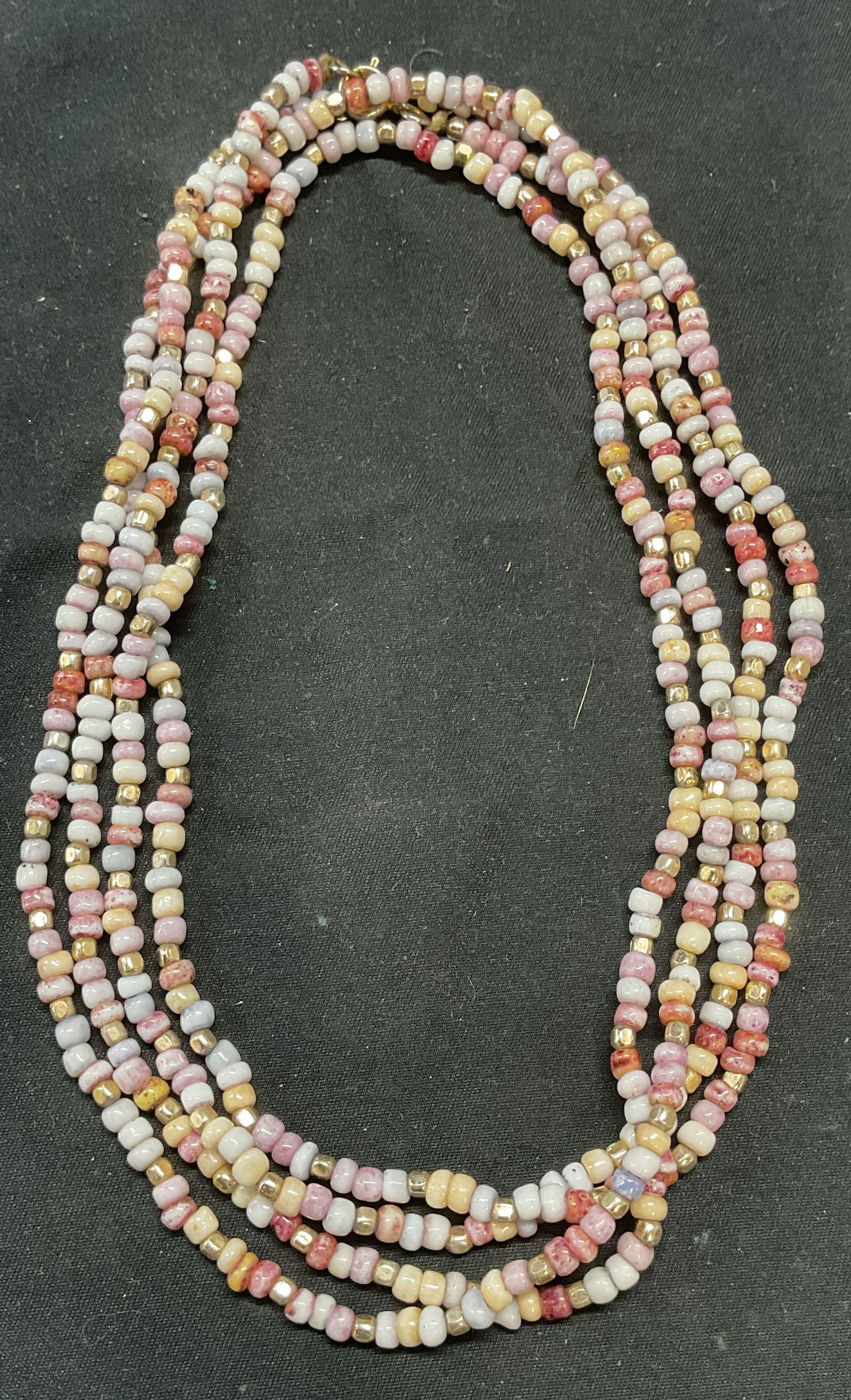 Vntg Purple & Gold Tn Seed Beaded Necklace: Vintage purple and gold toned seed beaded necklace. Drop length approx. 30 inches. Some surface wear including scratching observed. Jewelry, estate jewelry, costume jewelry, cocktail jewelry, fashion