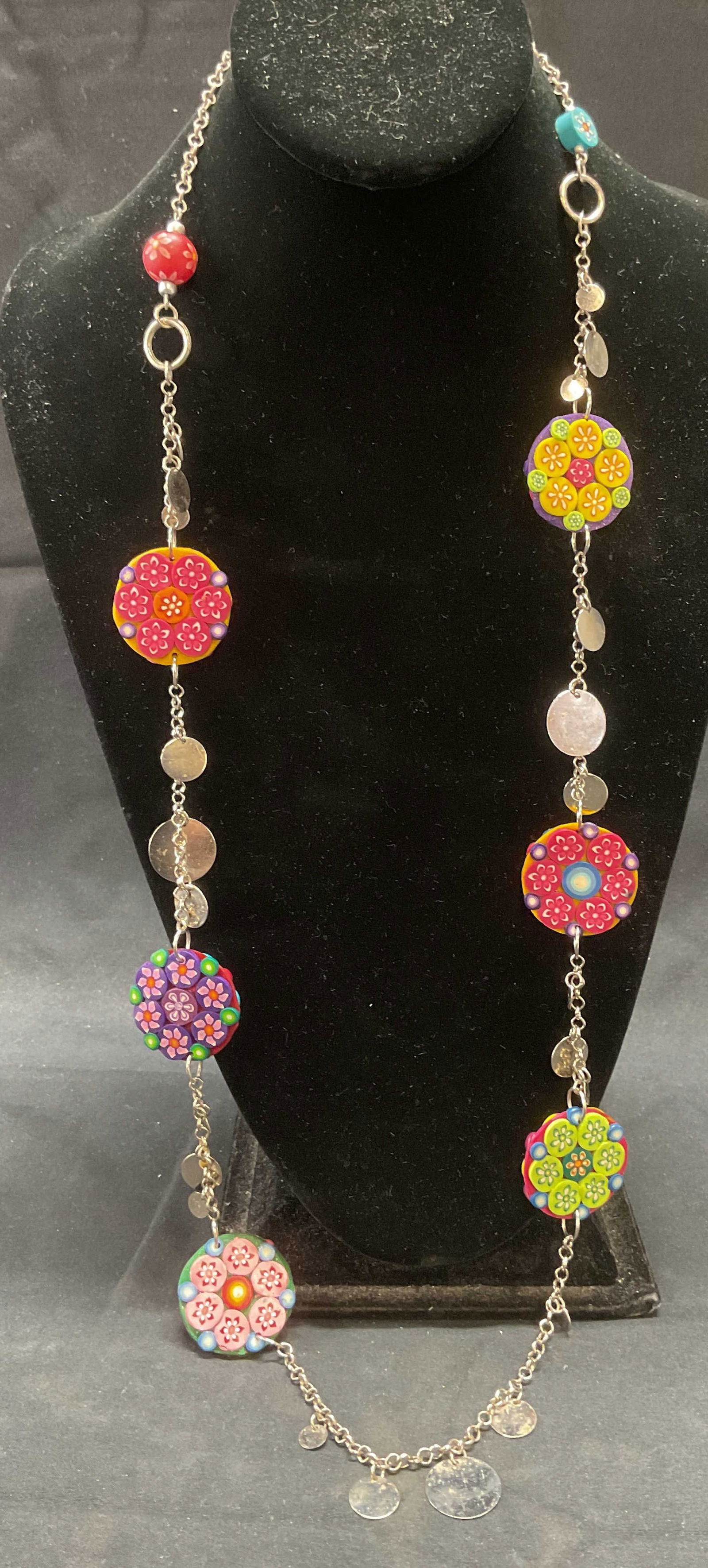 Silver Tone Flower Pendant Necklace: Silver tone necklace with multicolor handmade clay flower motif pendants. Drop length approx. 18 inches. Some surface wear including scratching observed. Jewelry, estate jewelry, costume jewelry, cock