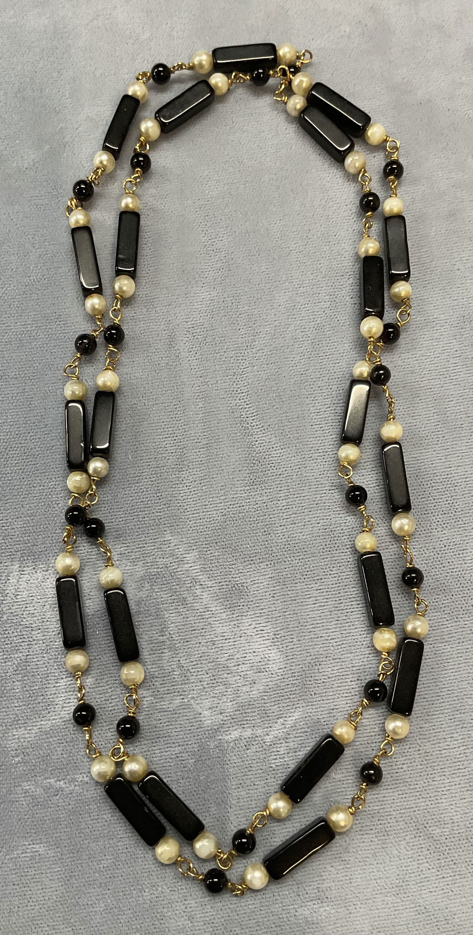 Gold Tone Faux Pearl & Black Lucite Necklace: Gold tone necklace with faux pearl and black lucite beads. Drop length approx. 14.5 inches. Some surface wear including scratching observed. Jewelry, estate jewelry, costume jewelry, cocktail jewelry,