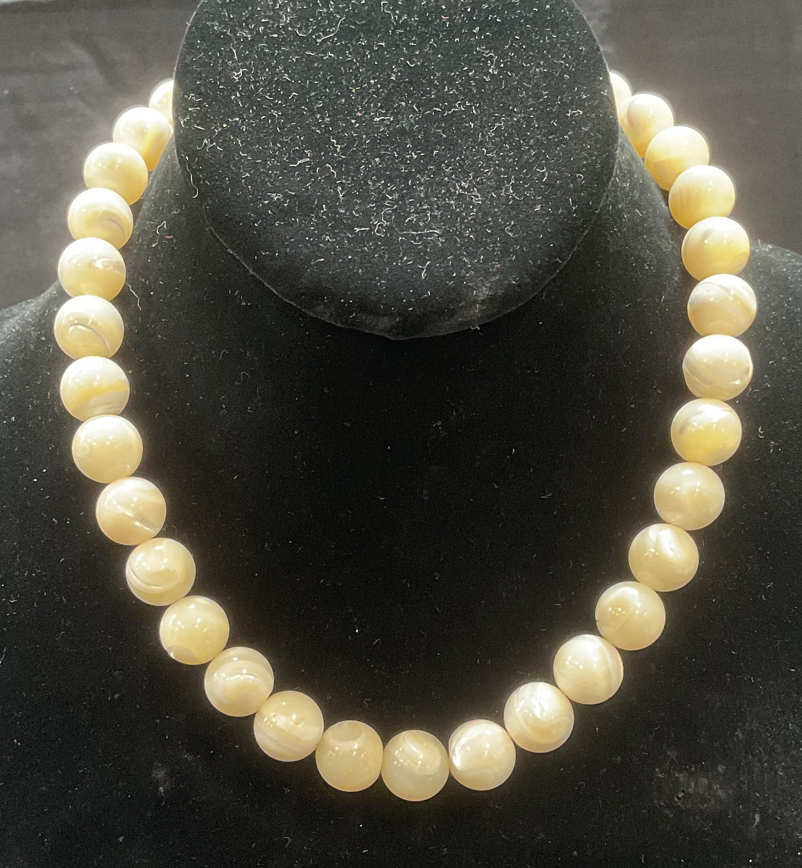 Vintage Art Deco Style Mother of Pearl Necklace: Vintage art deco style round beaded mother of pearl choker necklace. Drop length approx. 7.5 inches. Some surface wear including scratching observed. Some chipping observed. Jewelry, estate jewelry, c