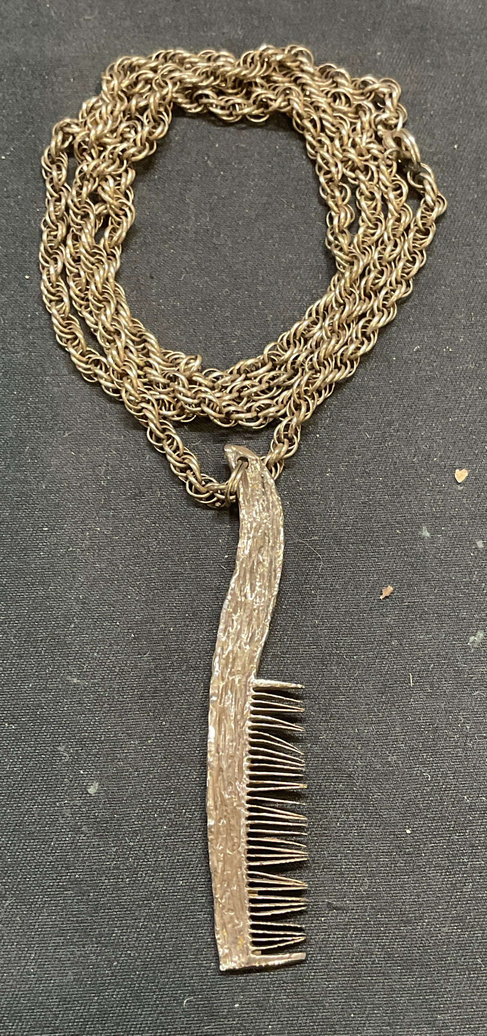 Vintage Sterling Silver Comb Pendant Necklace: Vintage sterling silver chain necklace with sterling silver comb motif pendant. Marked sterling on clasp. Pendant tests for sterling using PuriTEST kit. Drop length approx. 14 inches. Pendant measures