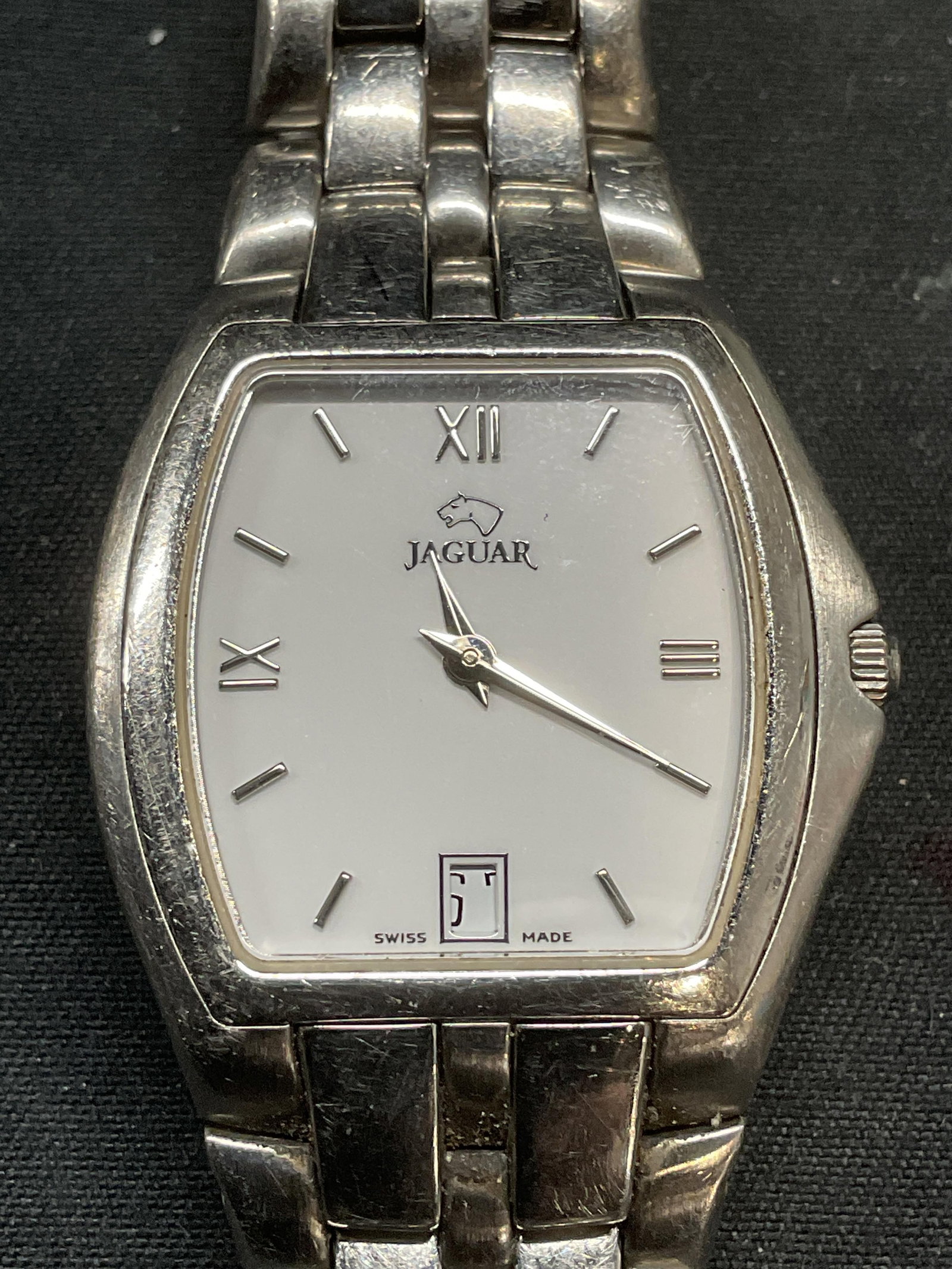Jaguar Silver Tone Chain Wrist Watch, Swiss: Jaguar Swiss made silver tone stainless steel chain band wrist watch. Signed on dial. Measures approx. 2.25 inches wide. Not tested for function. Some surface wear including scratching observed. Jewel