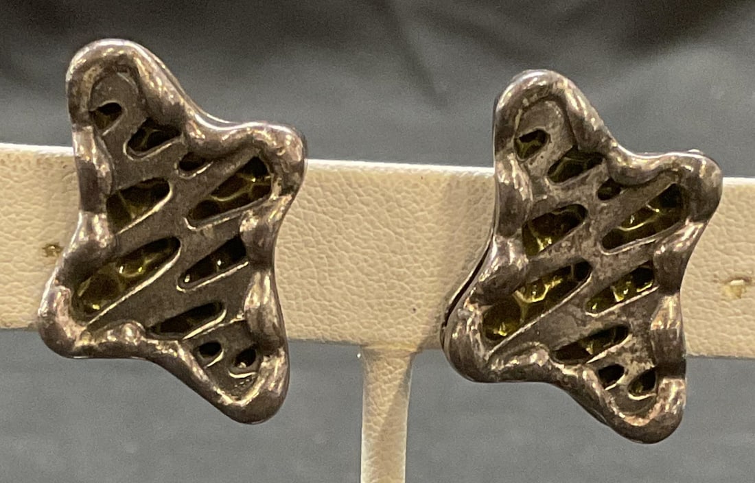 Vintage Coro Silver Tone Enamel Earrings: Vintage Coro silver tone clip on earrings with green enamel decoration. Signed to underside. Measures approx. 1 x .75 inches. Some surface wear including scratching observed. Jewelry, estate jewelry,