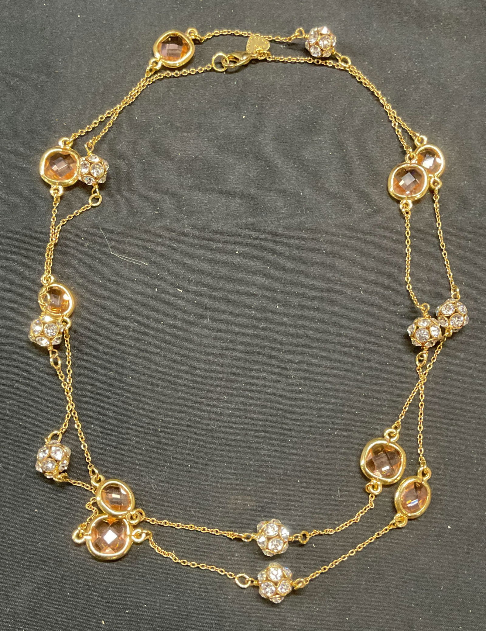 Gold Tone Pink Beaded Crystal Necklace: Gold tone beaded crystal necklace with pink and colorless crystal decoration. Drop length approx. 19 inches. Some surface wear including scratching observed. Jewelry, estate jewelry, costume jewelry,