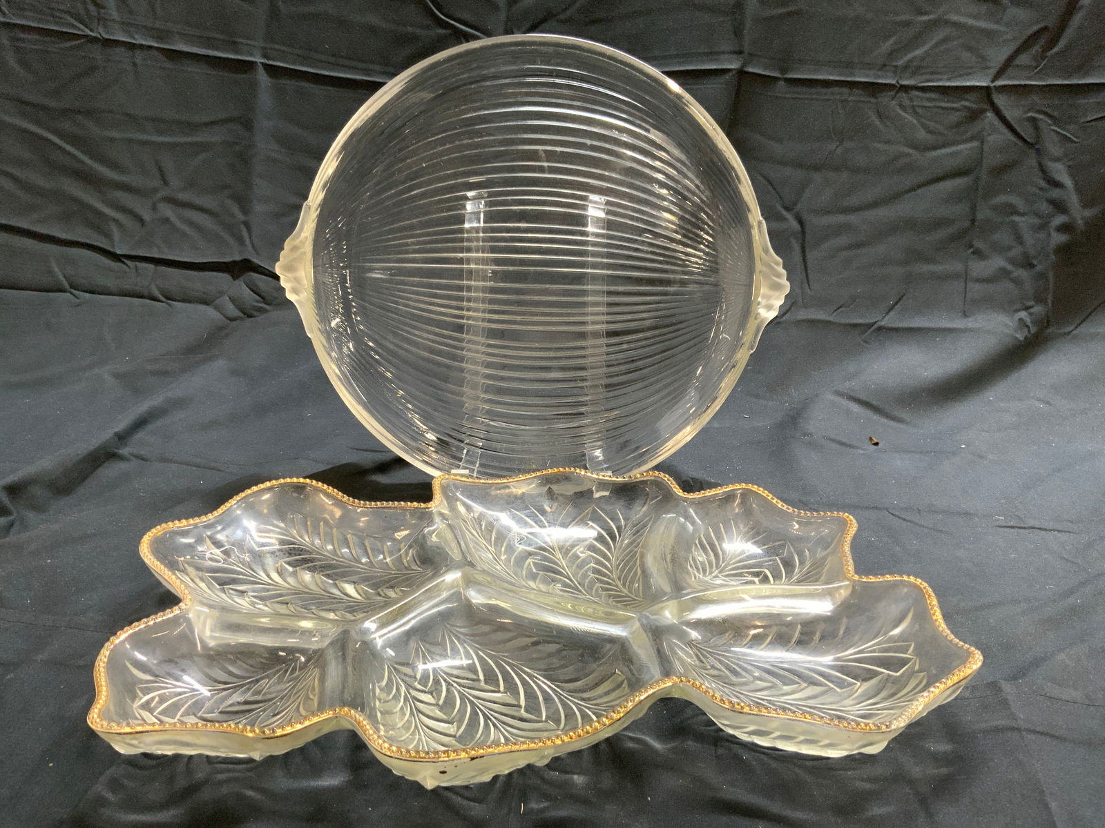 Lot 2 Art Glass Serving Dishes: Lot includes 1 leaf form glass serving dish & 1 onion form glass serving dish. Leaf form dish has gilt rim with beaded detail. Each have relief areas to show detail. Leaf form dish measures approximat